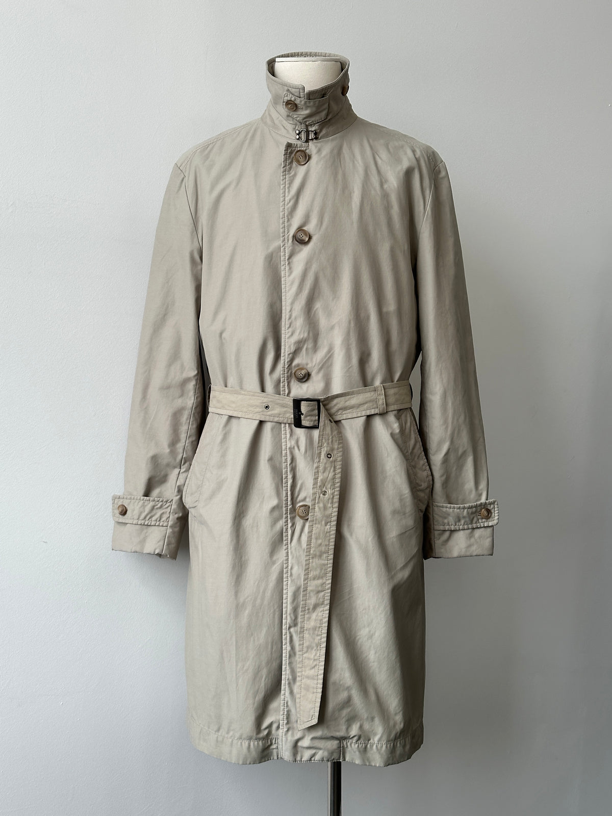 Hugo Boss 2000s high neck belted trench coat in beige, tailored fit, with button details and waist belt, stylish and sophisticated.