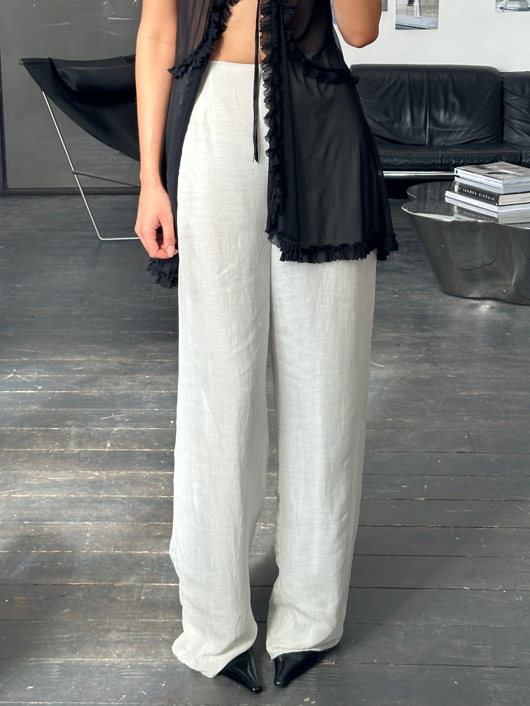 Giorgio Armani 1999 wide leg linen trousers in size W28-30, beige color, showing the relaxed fit and lightweight fabric.