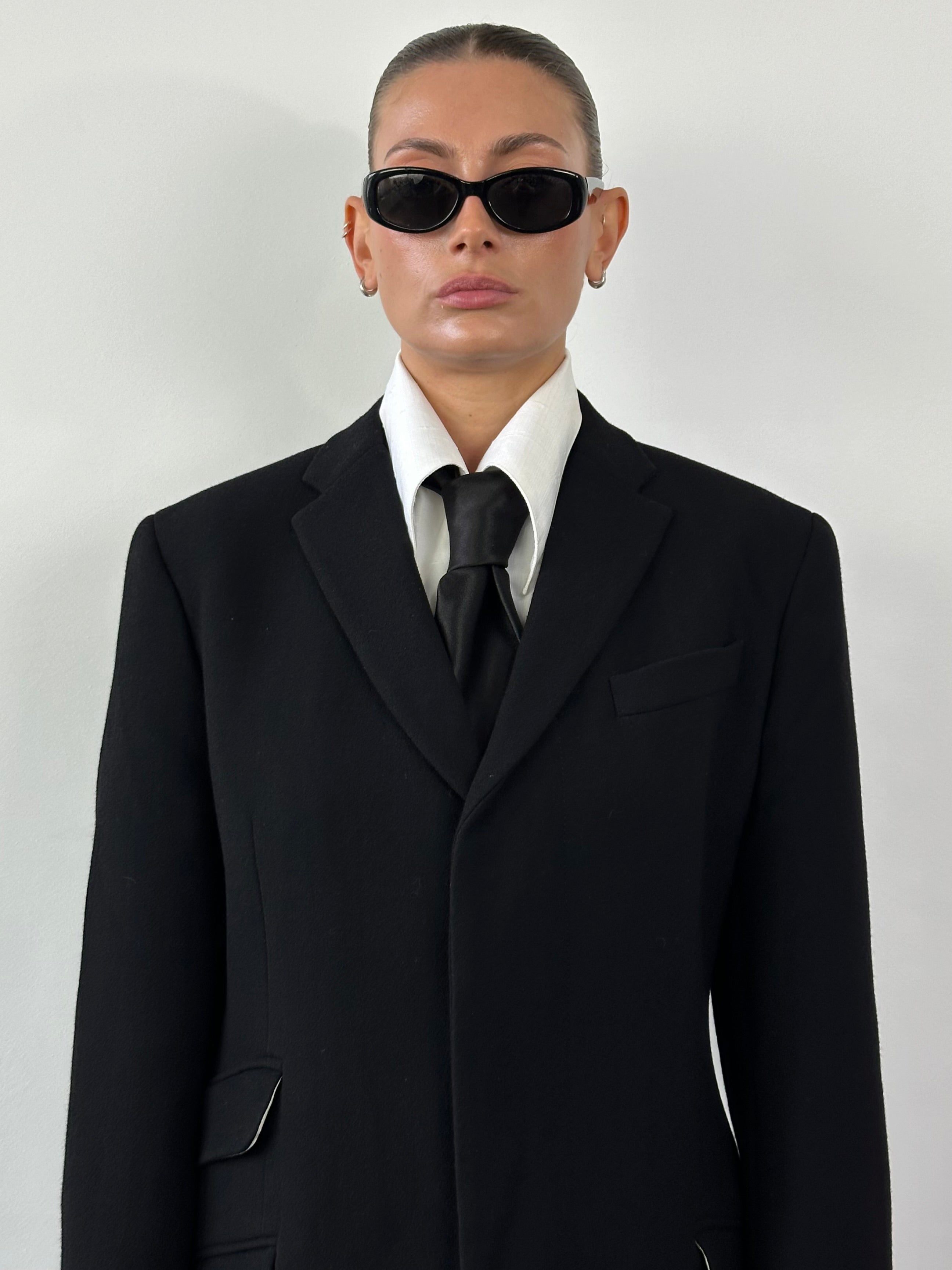 Dolce & Gabbana pure wool single-breasted coat in size M, front view showing tailored fit and classic lapel design.