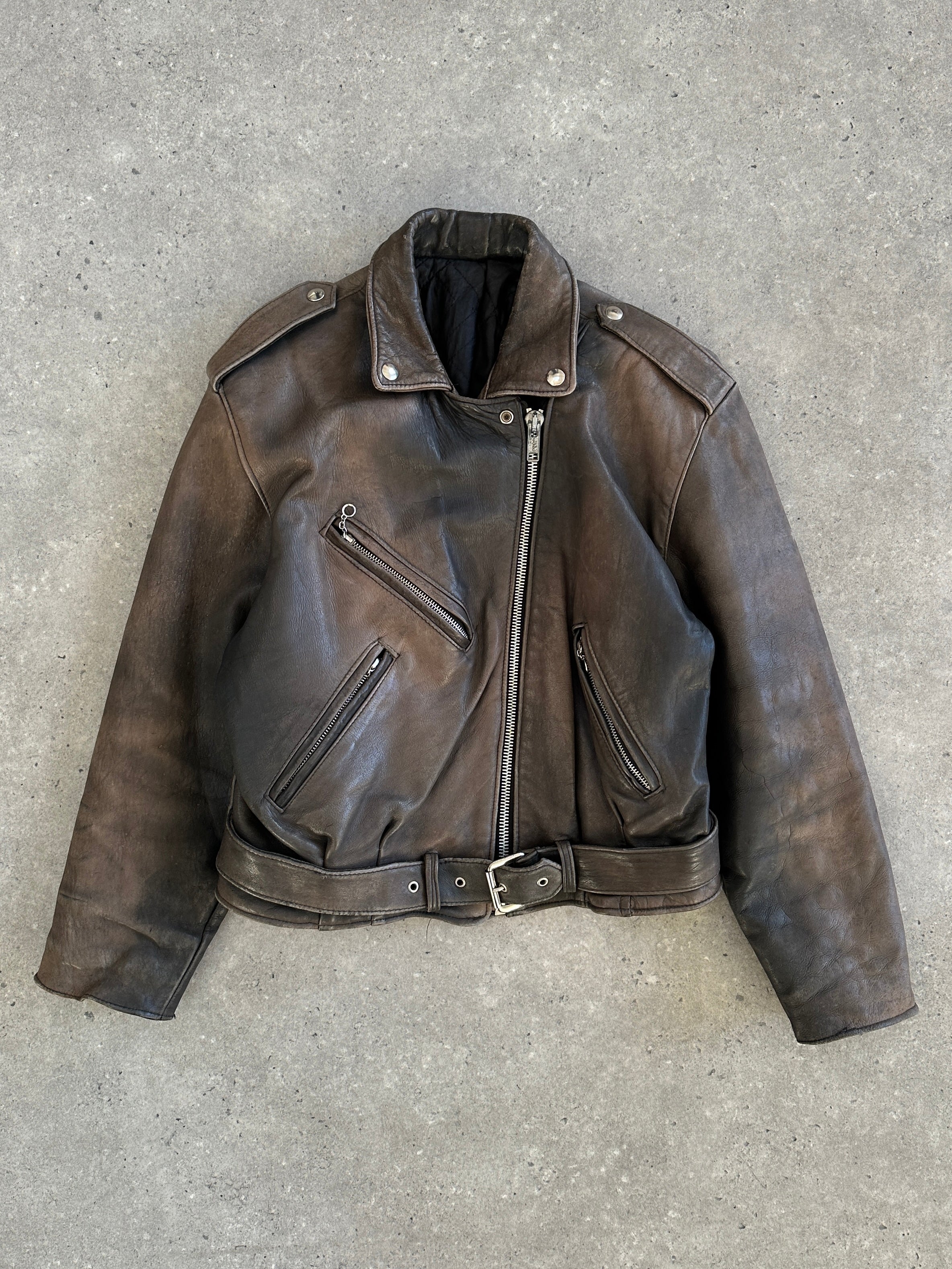 Vintage 1980s distressed leather biker jacket with rugged texture and classic design, size small, from the Vintage brand.