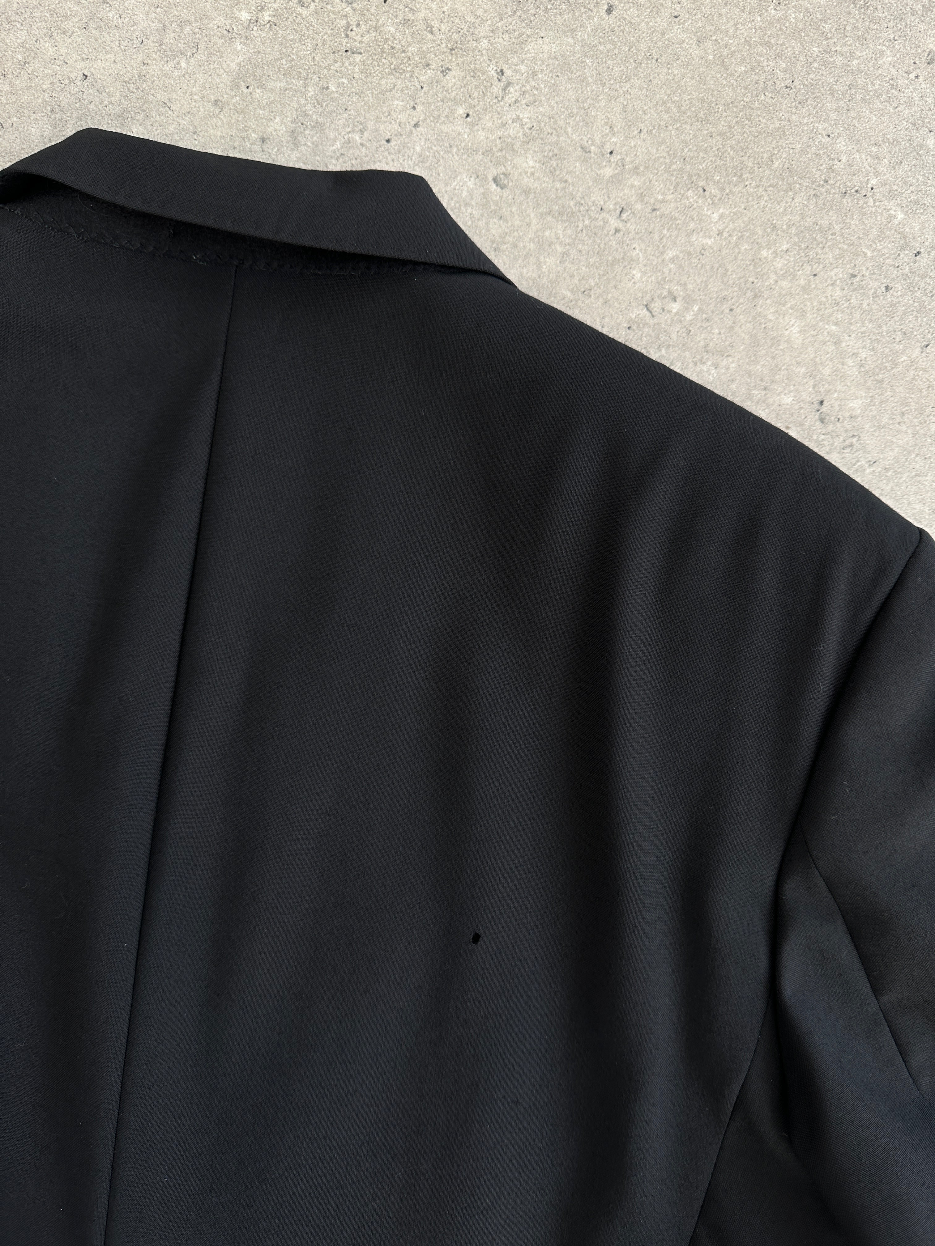 Jaeger tuxedo suit, double-breasted style in pure wool, size 42R/W28, shown on a mannequin with lapels and front buttons.