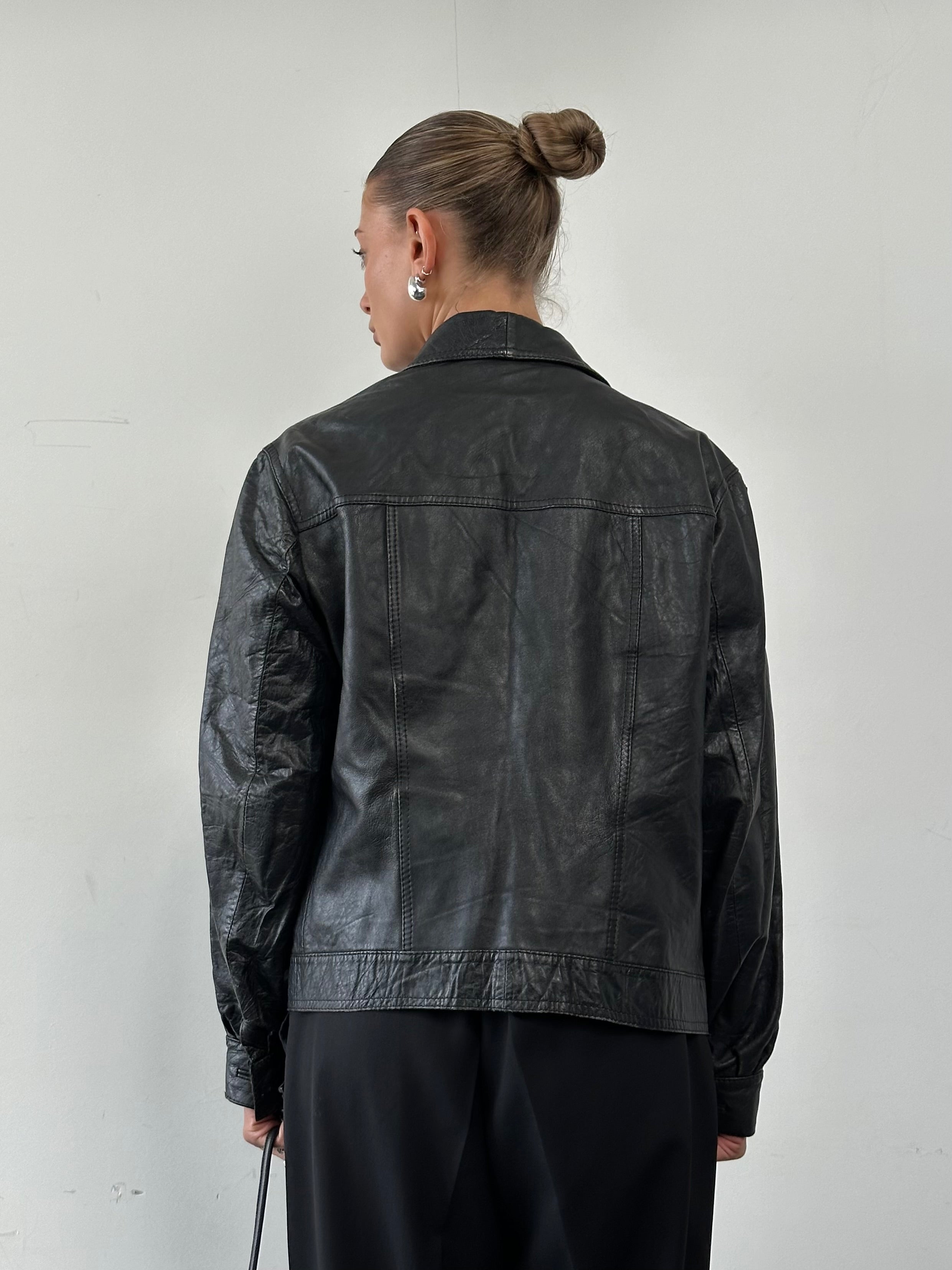 Vintage brand vintage leather jacket with dagger collar, slim fit style, featuring rugged leather and detailed stitching.