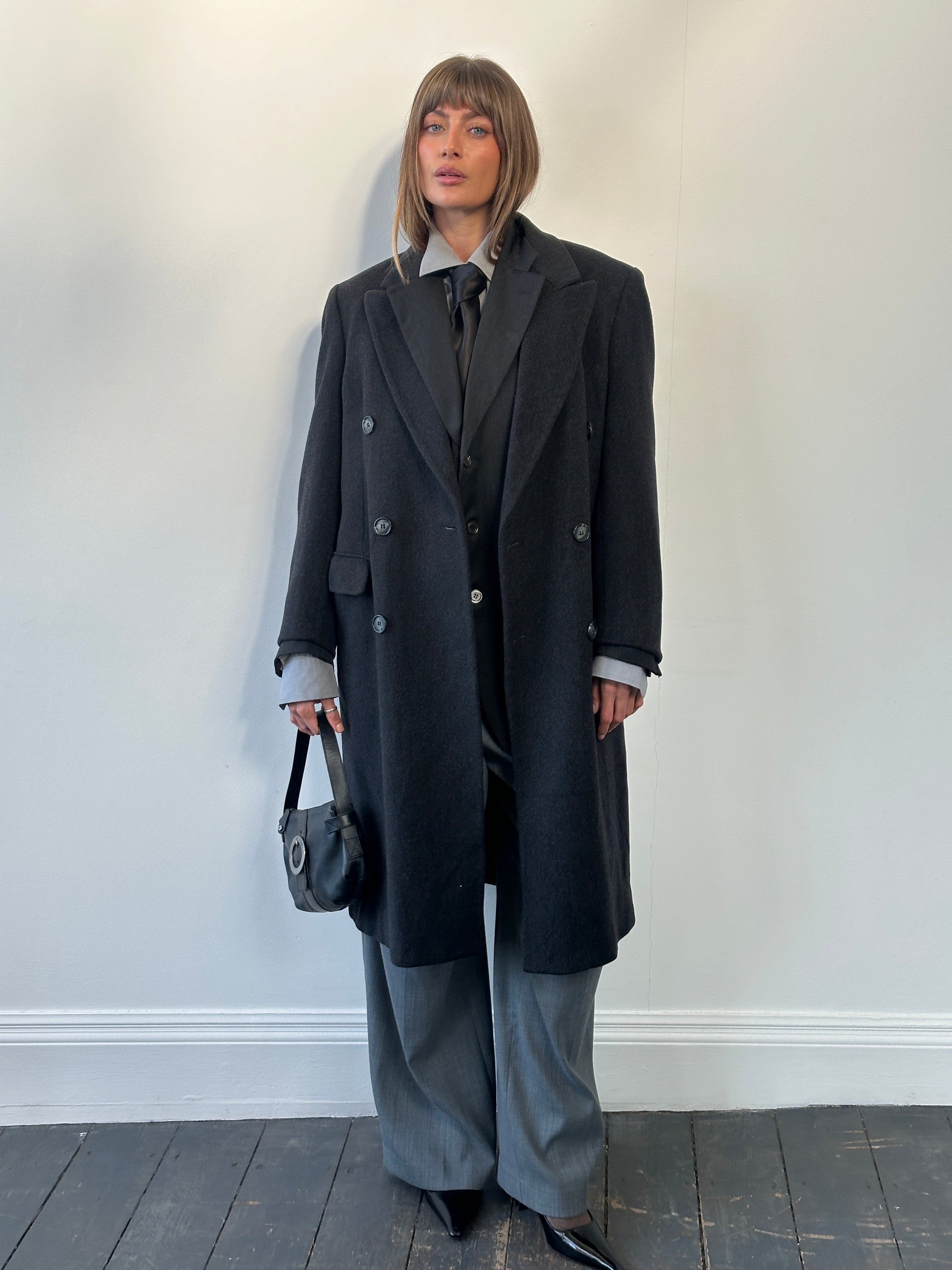 Vintage 1980s pure wool double-breasted coat in size L, showcasing classic design and textured fabric.