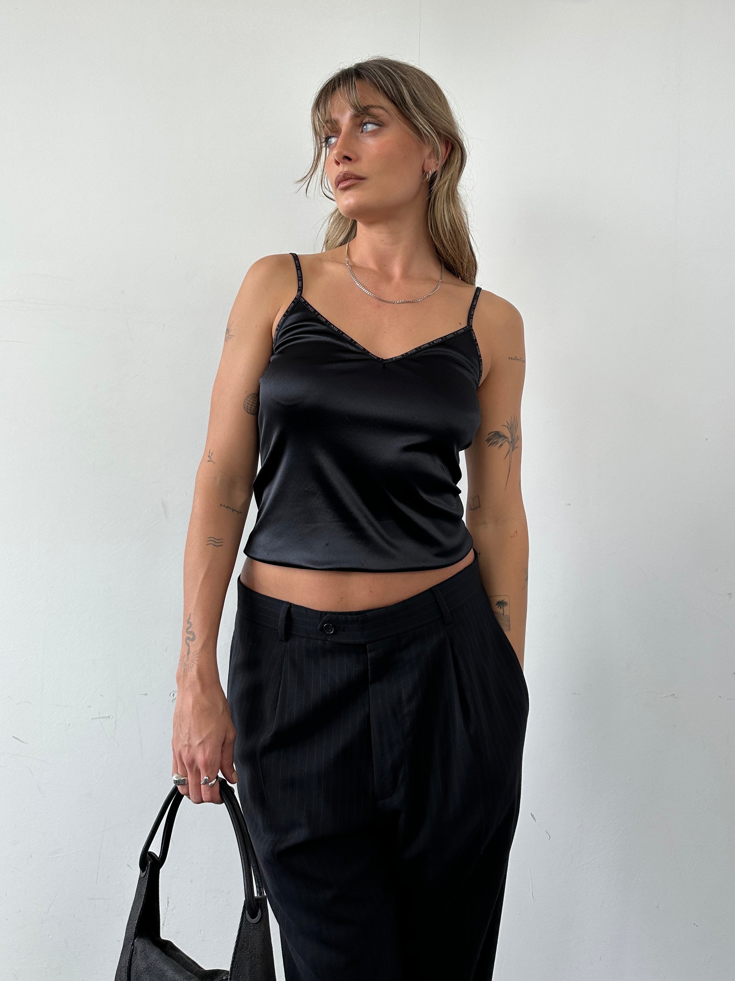 Guess stretch spaghetti cami top in black, lightweight and fitted with thin straps, perfect for casual or layered outfits.