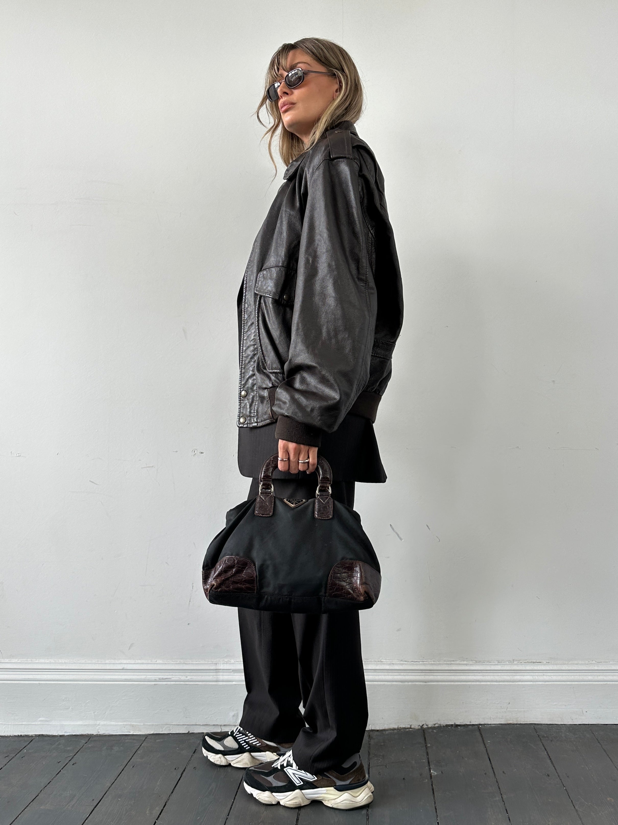 Prada nylon croc handbag featuring sleek design, textured crocodile pattern, and sturdy nylon straps for stylish everyday use.