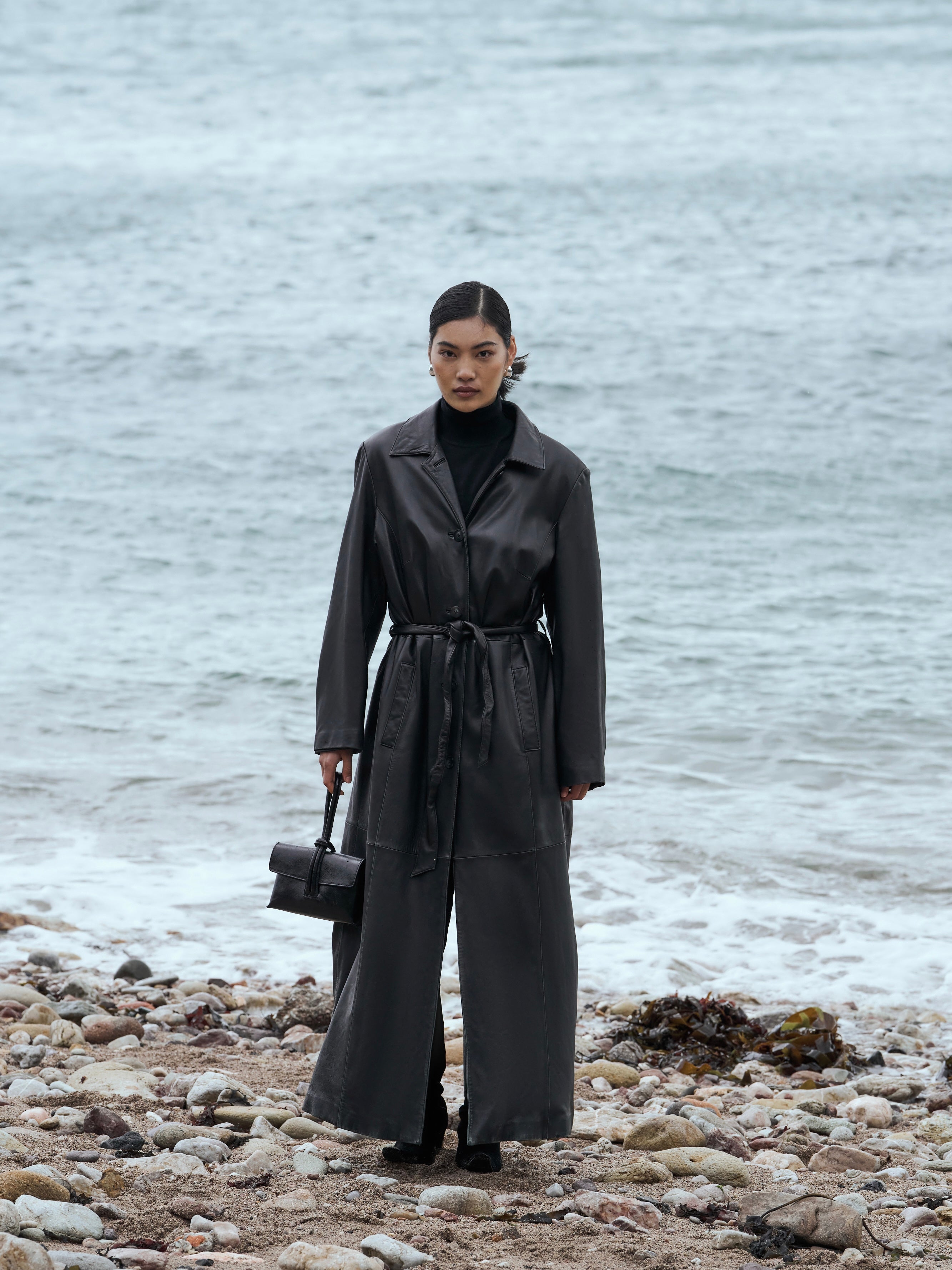 Vintage leather trench coat, floor length belted style, XL size, featuring classic design and leather material.