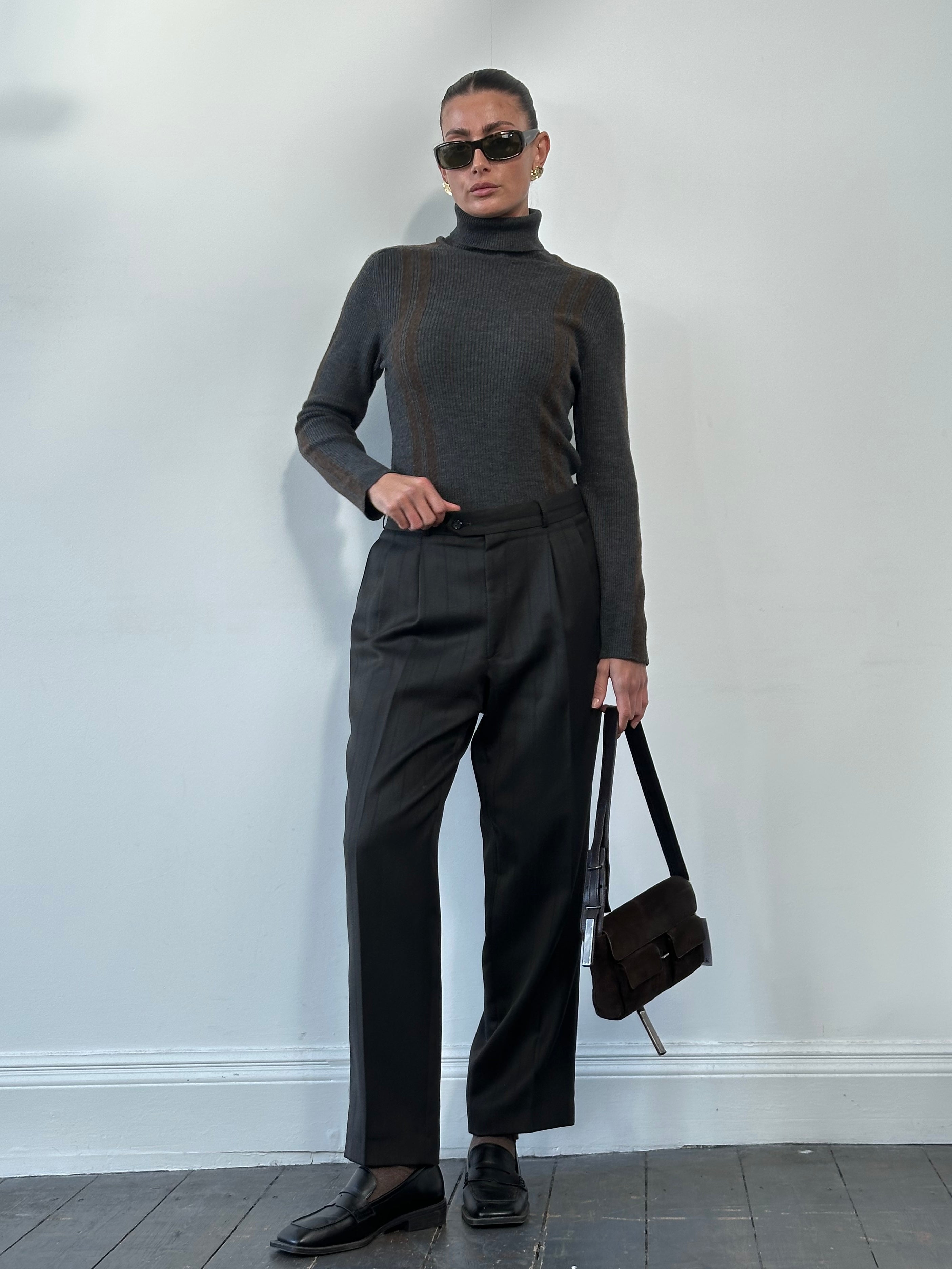 Dolce & Gabbana wool rib knit turtle neck jumper in size M, featuring a cozy, fitted design in classic neutral tones.