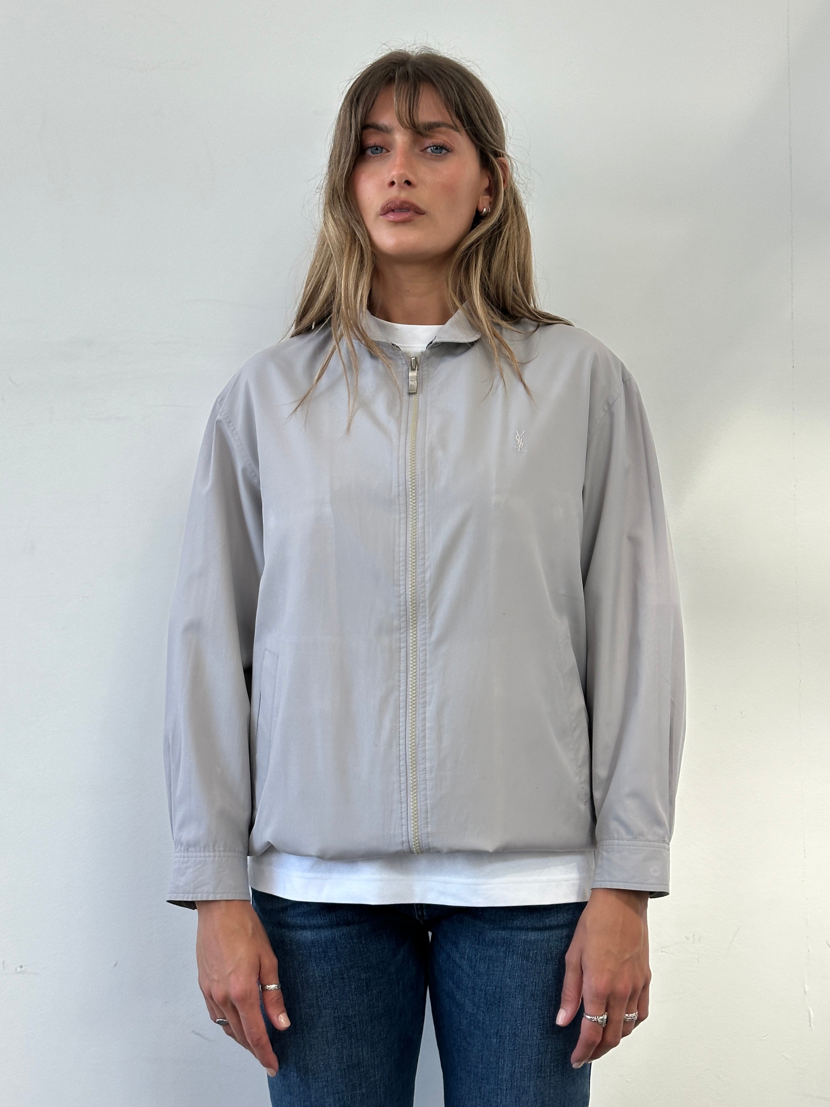 Yves Saint Laurent logo bomber jacket in size M, featuring a sleek design with the iconic YSL branding on the front.