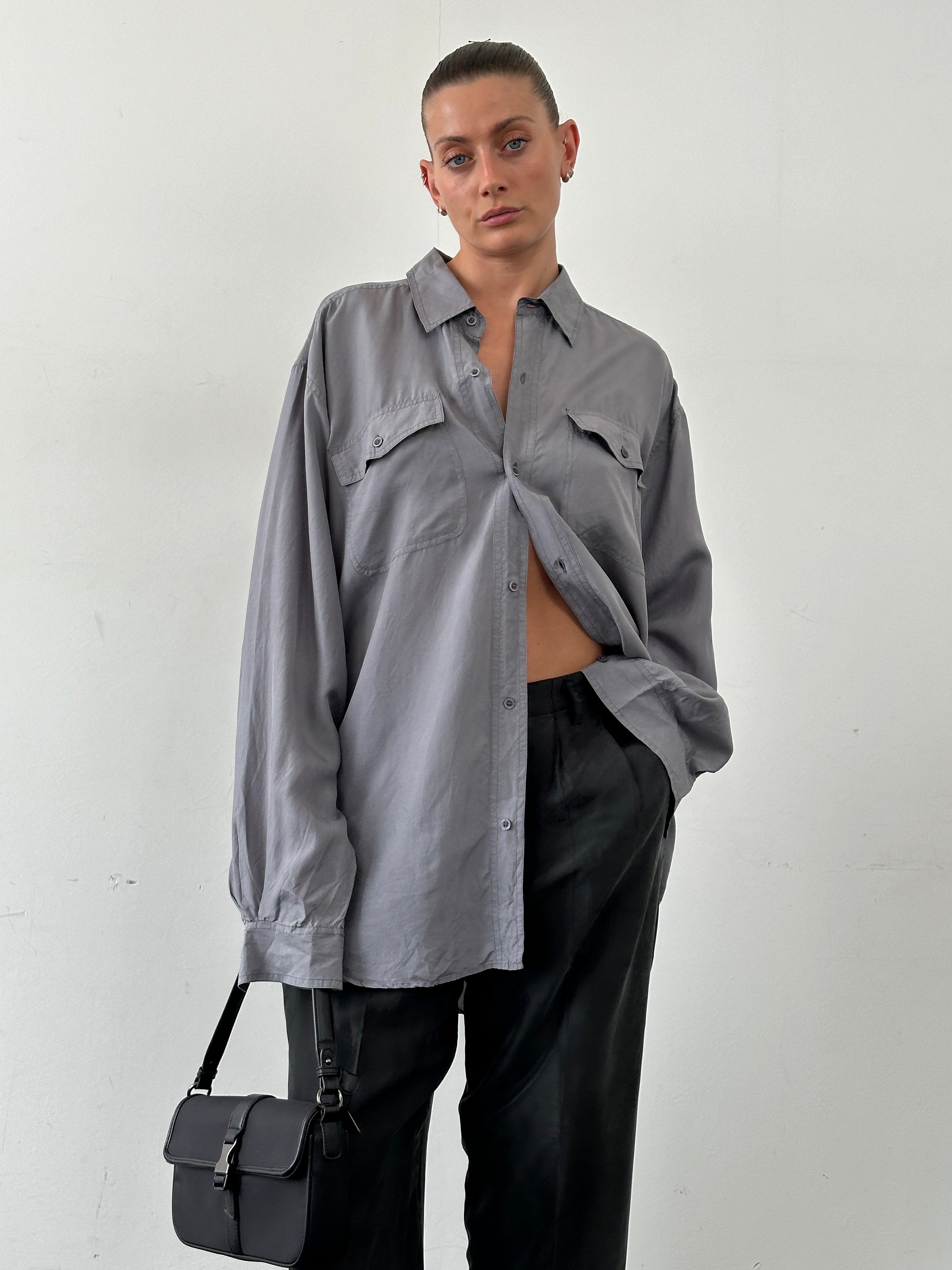 Vintage pure silk shirt in XXL size, featuring a classic design with a smooth, shiny fabric and a collar, displayed on a hanger.