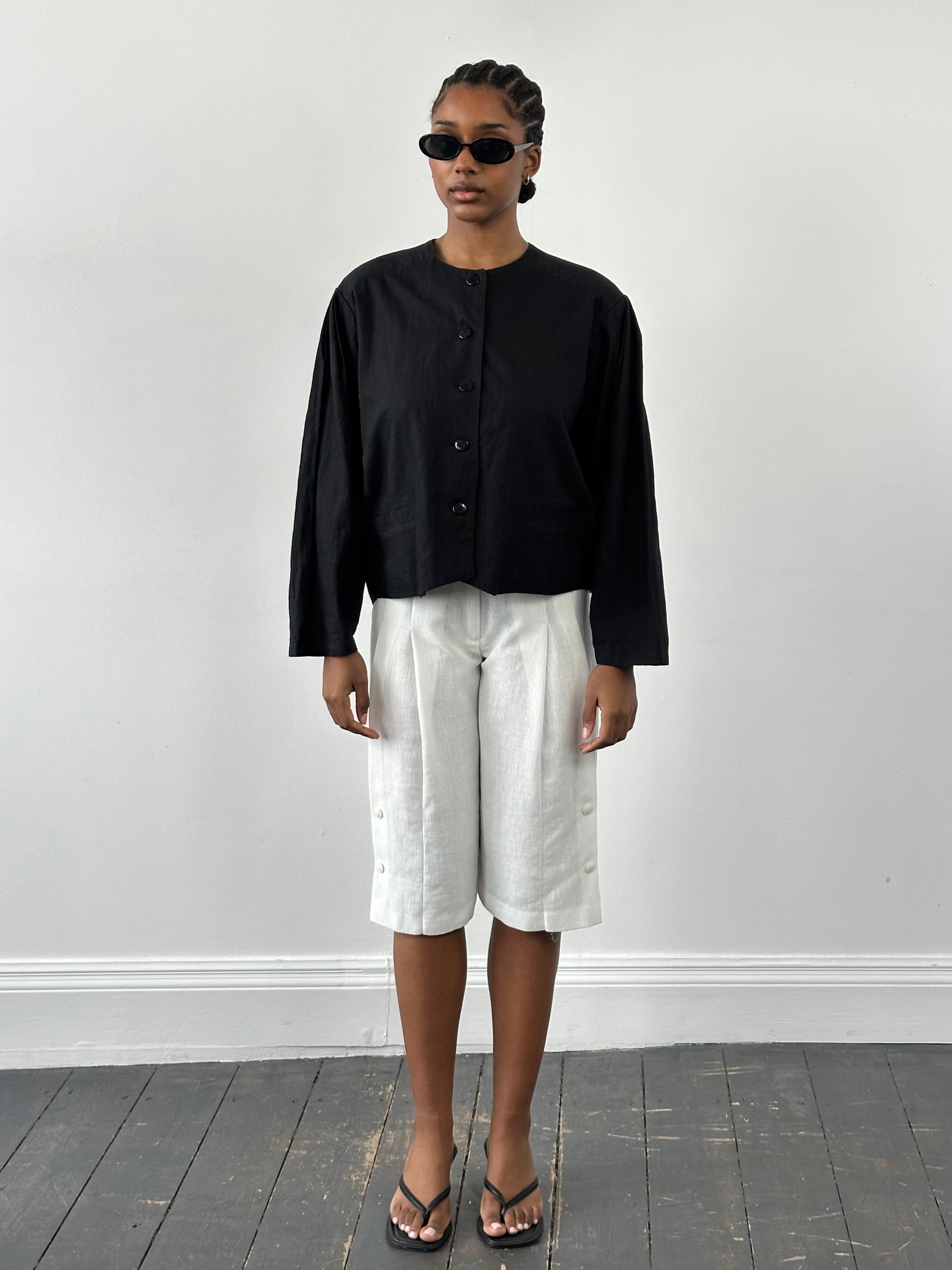 Vintage 1990s linen cotton boxy crop jacket in beige, showing front view with collar and button details.