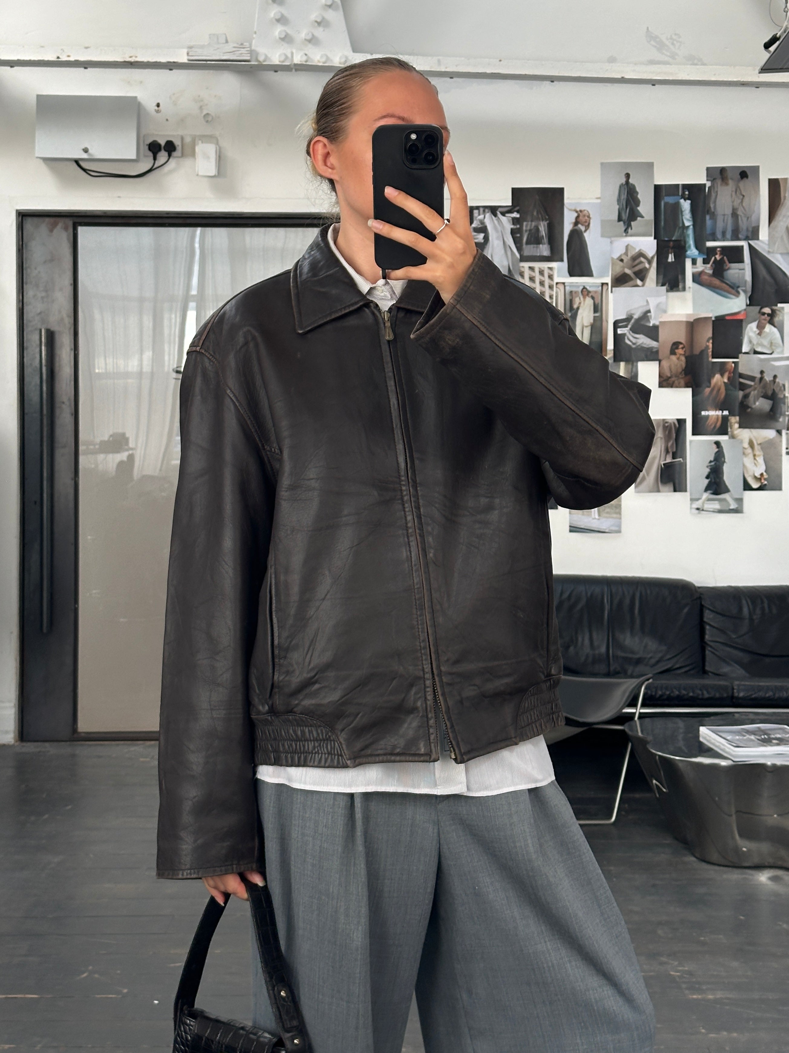 London Fog distressed leather jacket in size L, showcasing a vintage 1990s style with worn, rugged leather and classic design.