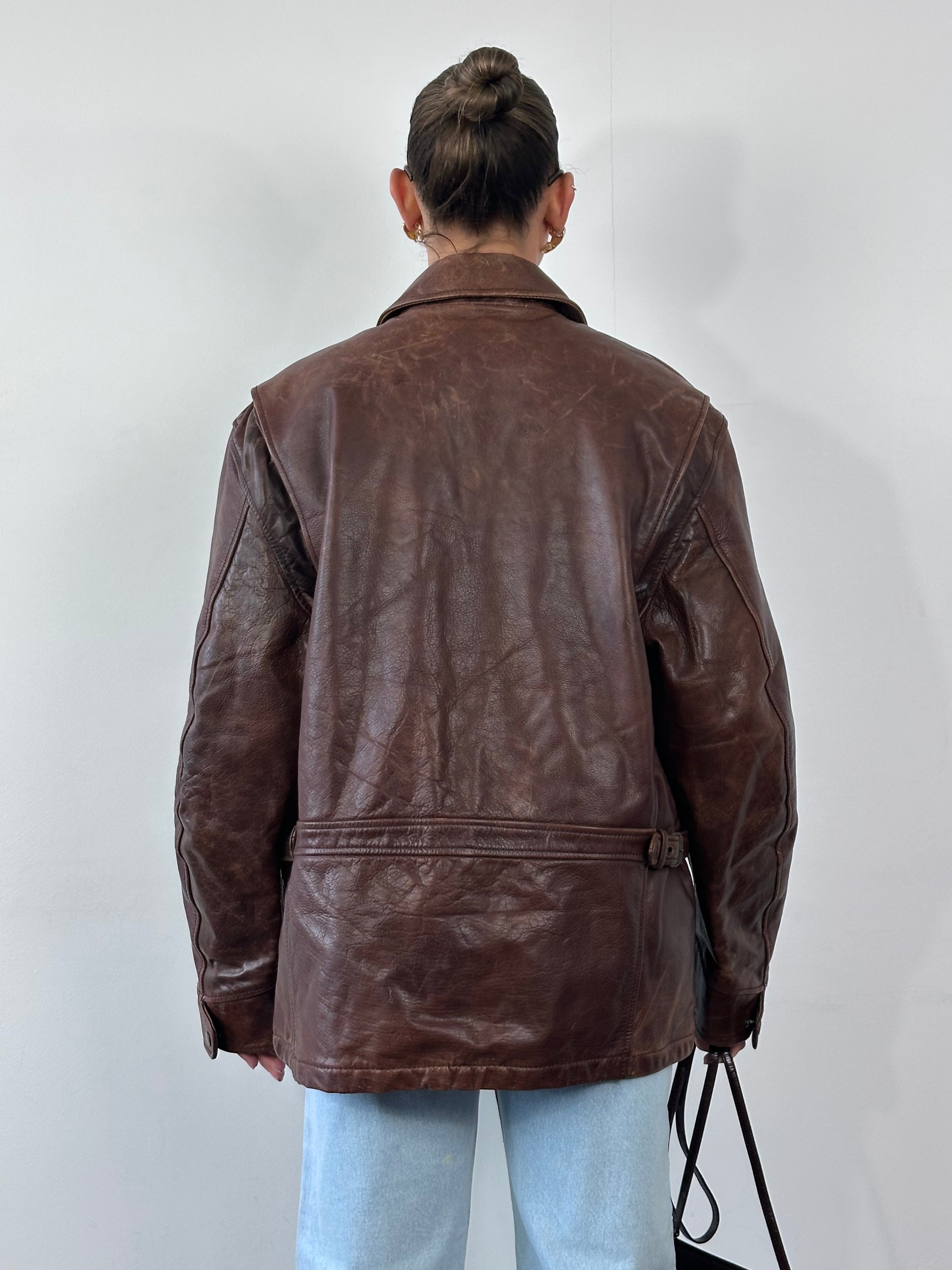 Vintage heavyweight leather jacket in XL size, aged and distressed leather with classic design and sturdy construction.