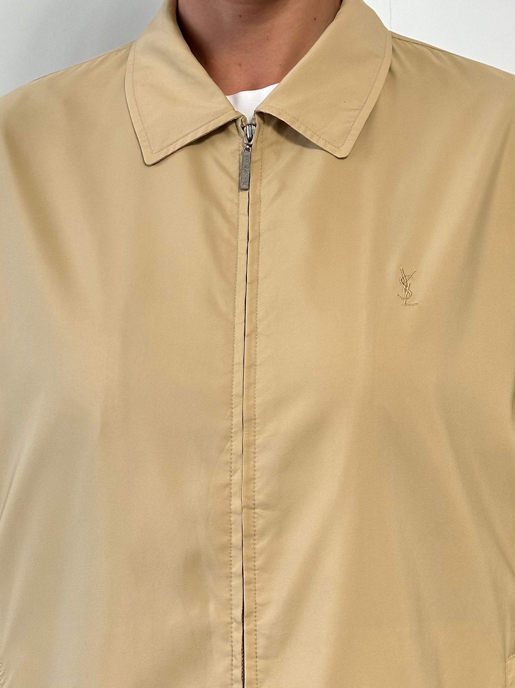 Yves Saint Laurent Pour Homme logo bomber jacket in black, featuring a front zipper, ribbed cuffs, and embroidered YSL logo.