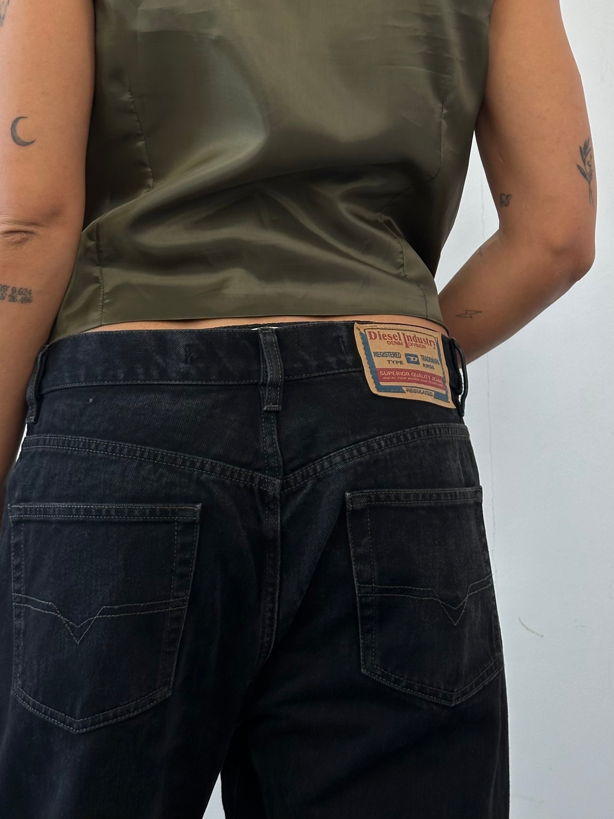 Diesel high waisted straight leg denim jeans, W32, featuring classic blue denim with subtle fading and a fitted waistband.