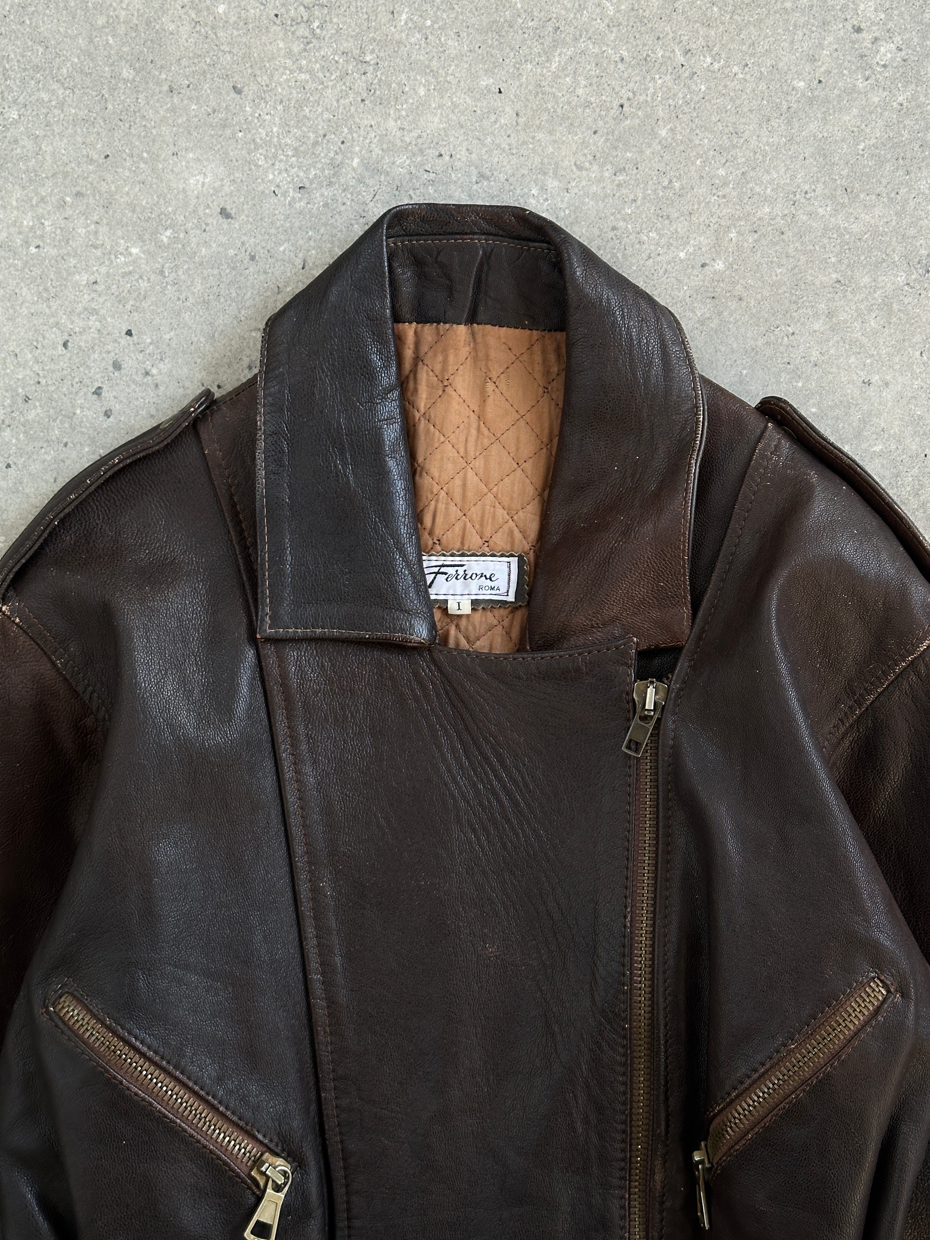 Vintage Italian 1990s belted leather jacket, aged distressed brown leather, size M, classic retro style, front view.