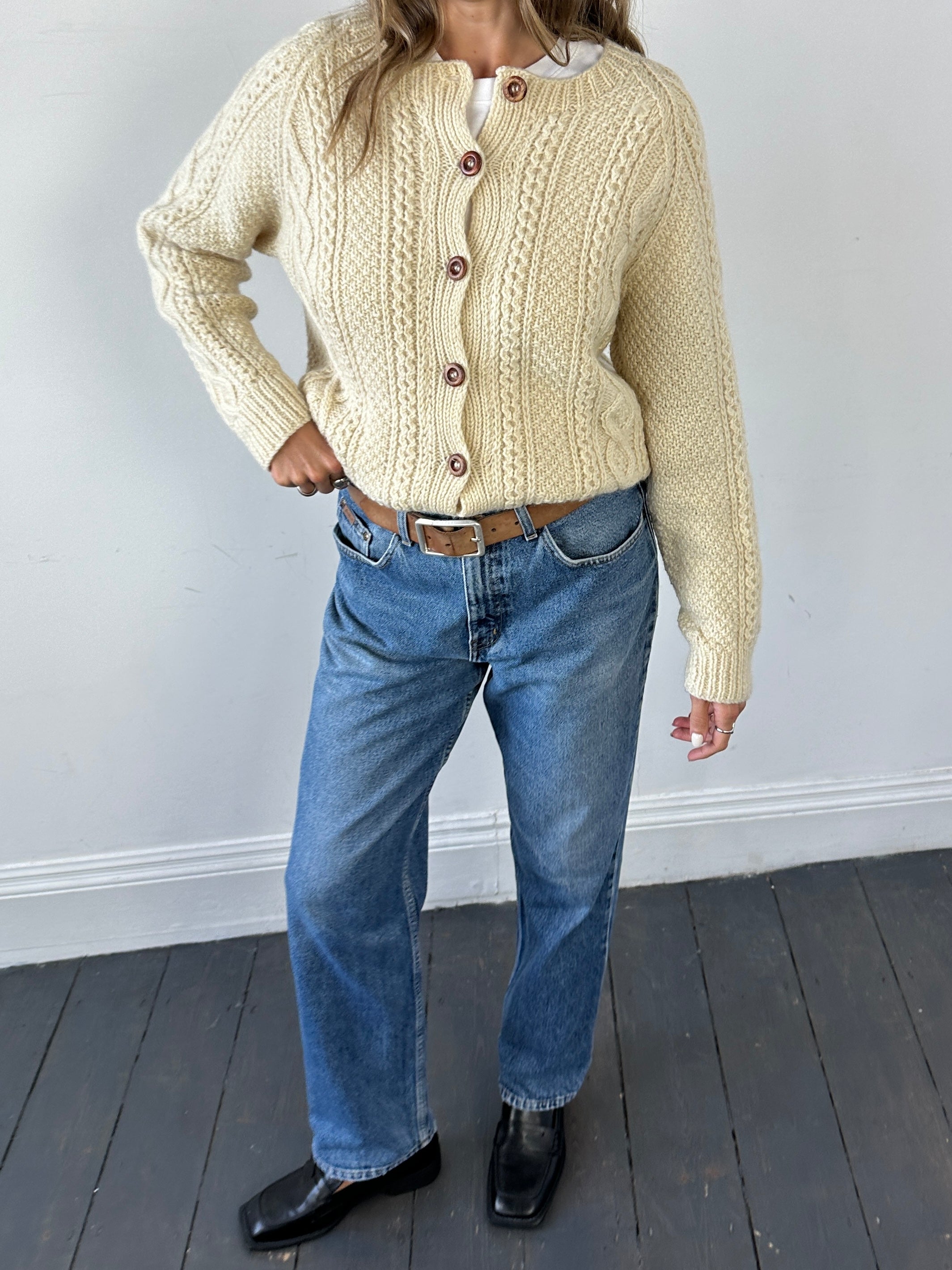 Vintage wool cable knit cardigan in size L, featuring classic textured pattern and cozy, warm fit.