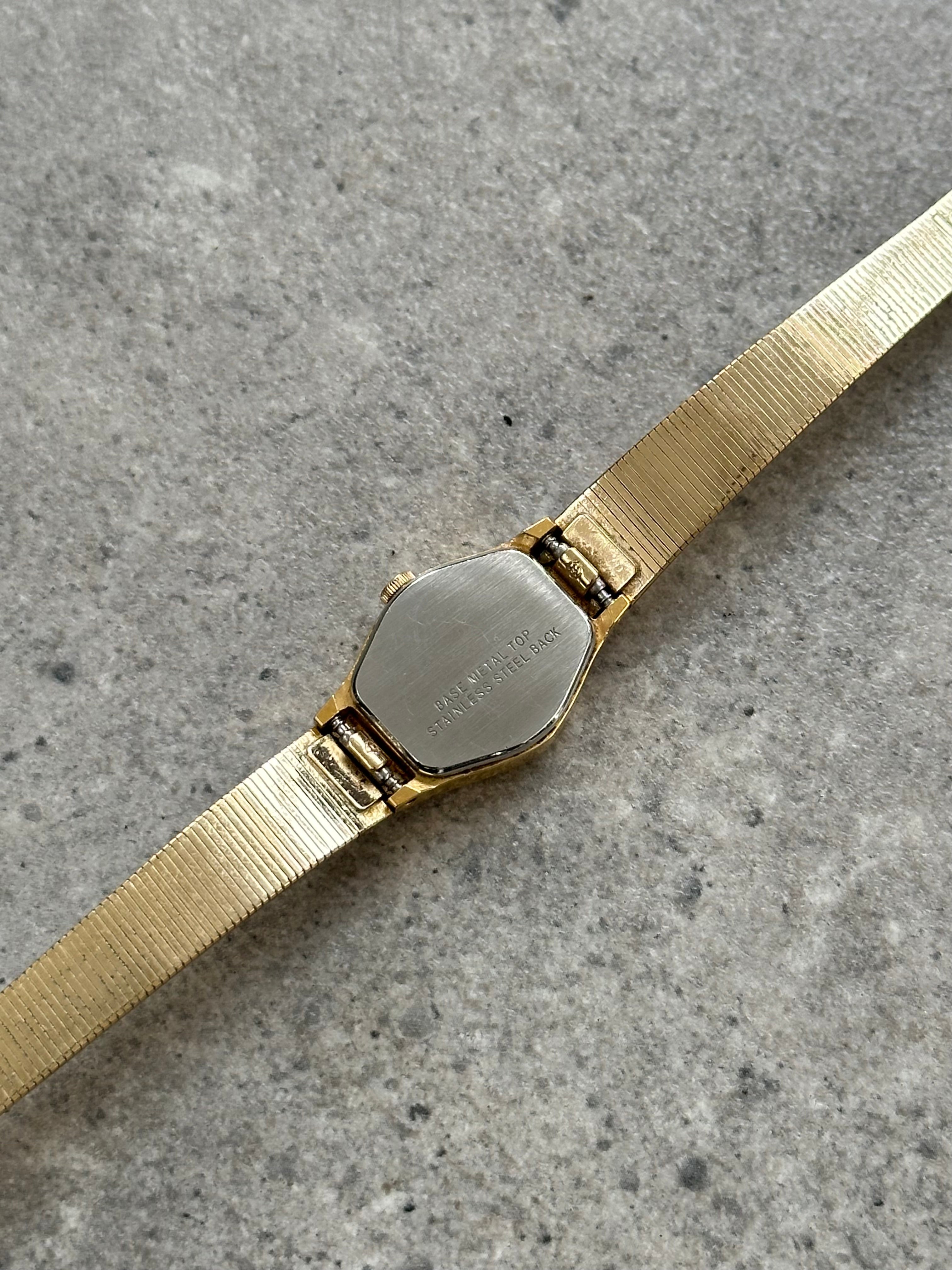 Accurist 1990s gold-tone octagonal quartz watch with a classic design and metallic finish.