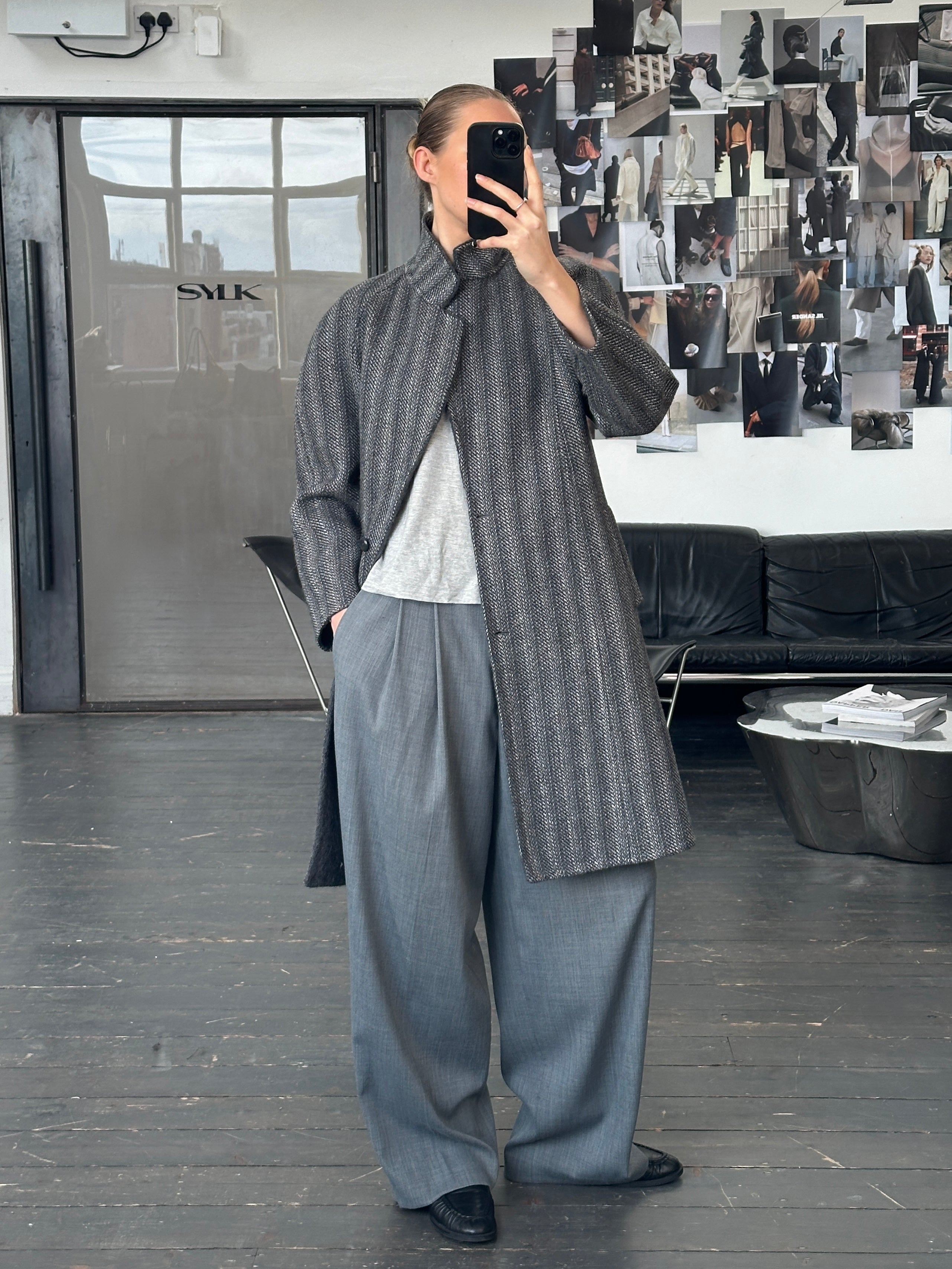 Marina Rinaldi 1990s pure wool double-faced single-breasted coat in size S, shown hanging with lapels and tailored fit.