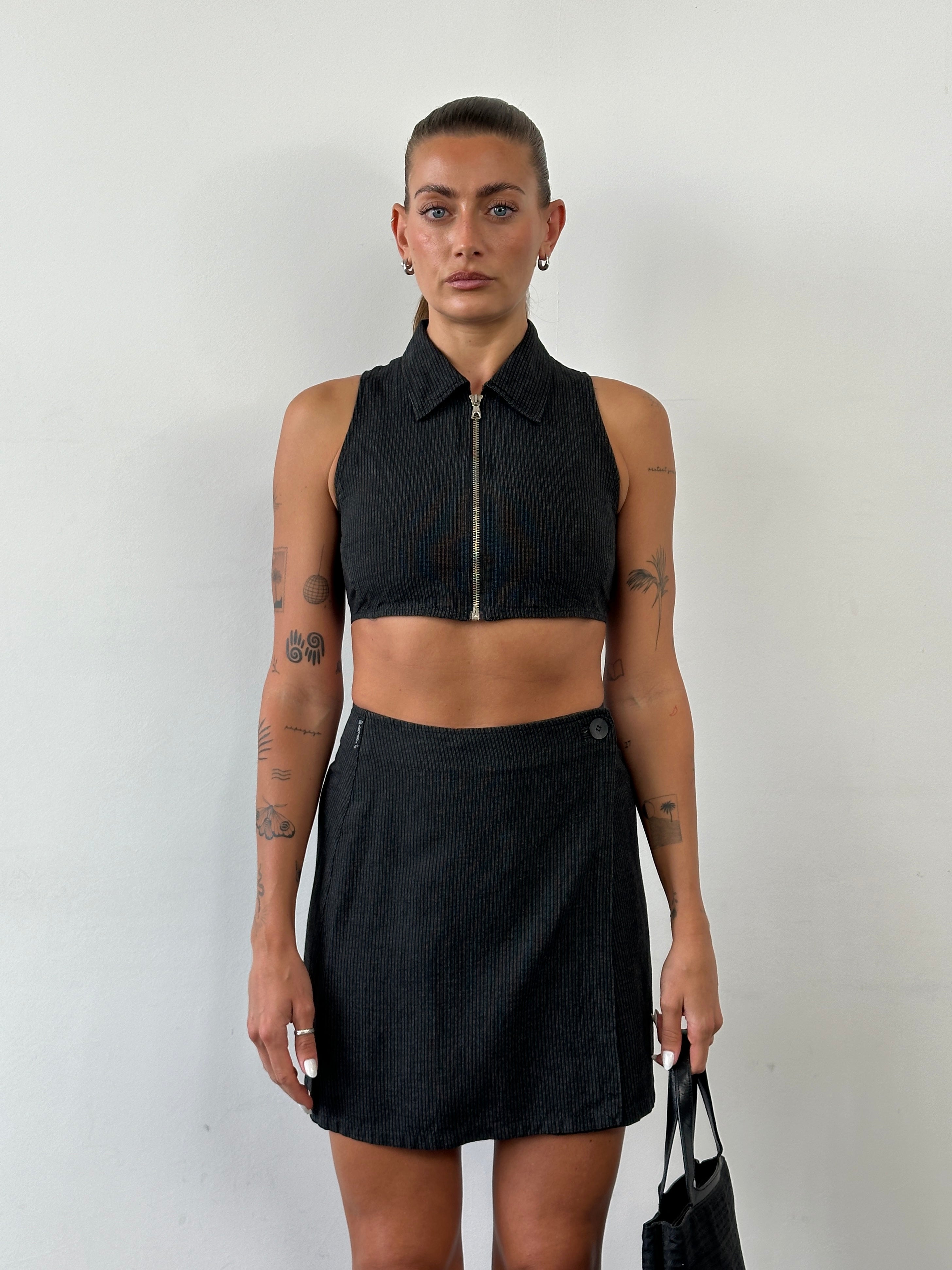 Armani Jeans linen stripe two-piece skirt set displaying a stylish striped skirt and matching top on a mannequin.