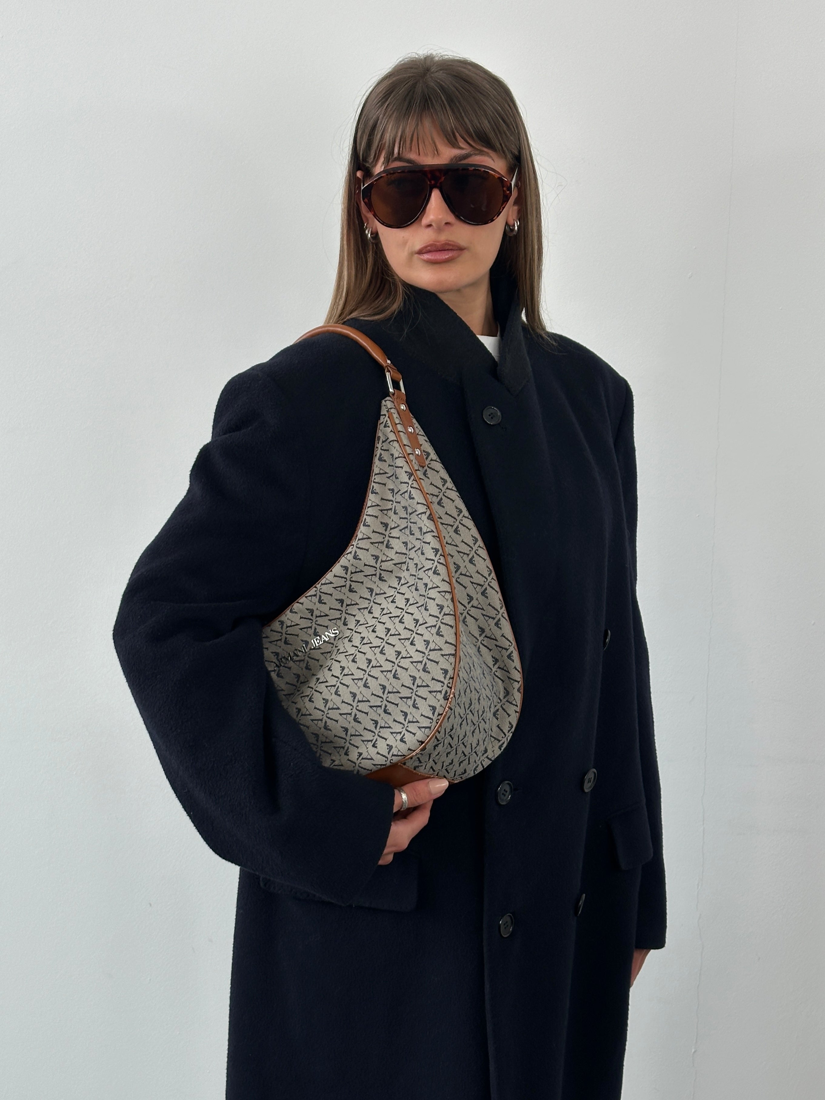 Vintage 1990s wool cashmere double-breasted coat in XL, featuring classic design and textured fabric, displayed on a hanger.