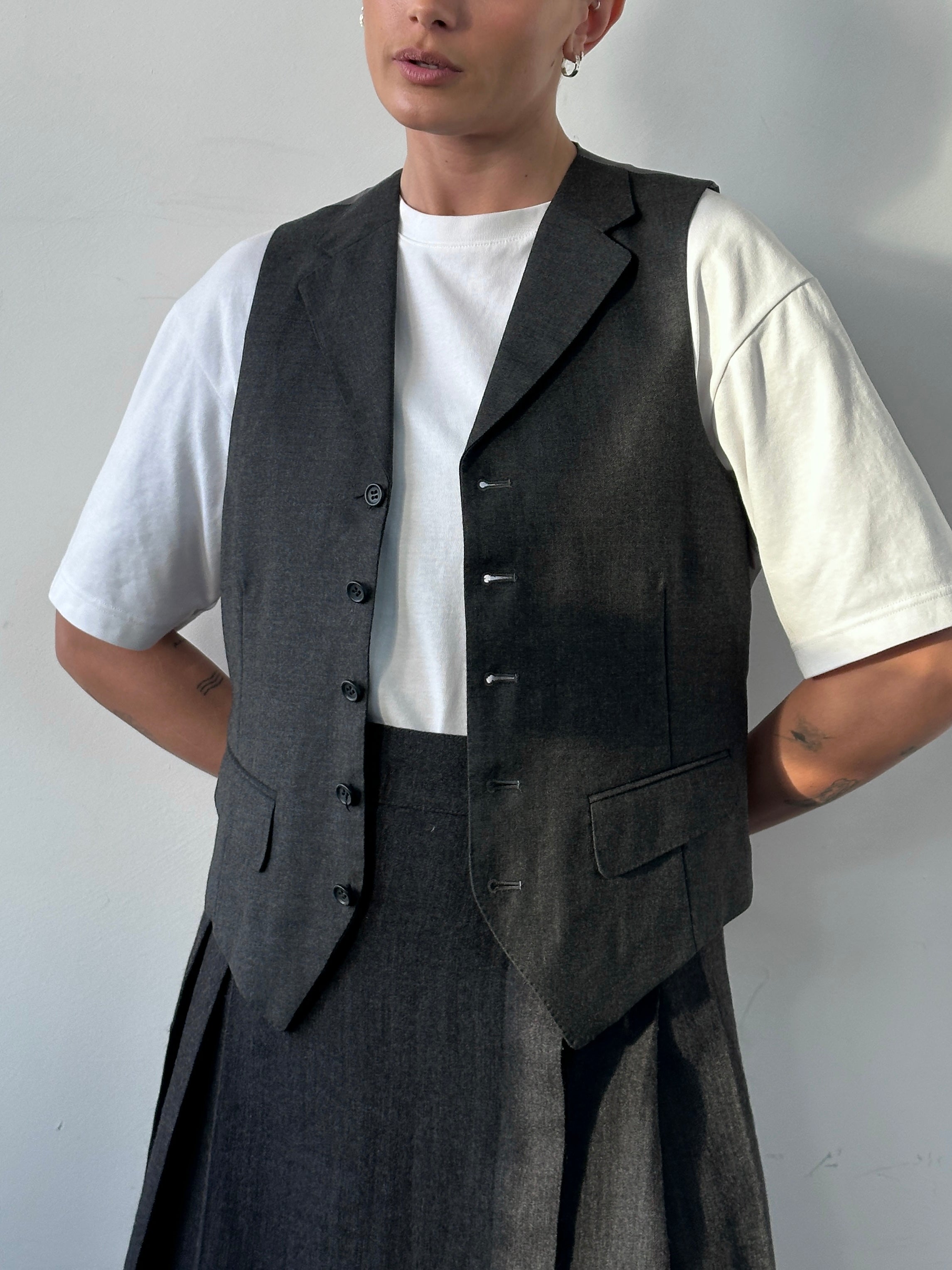Vintage brand vintage collared wool waistcoat, size M, showcasing the classic design and textured fabric of the coat.