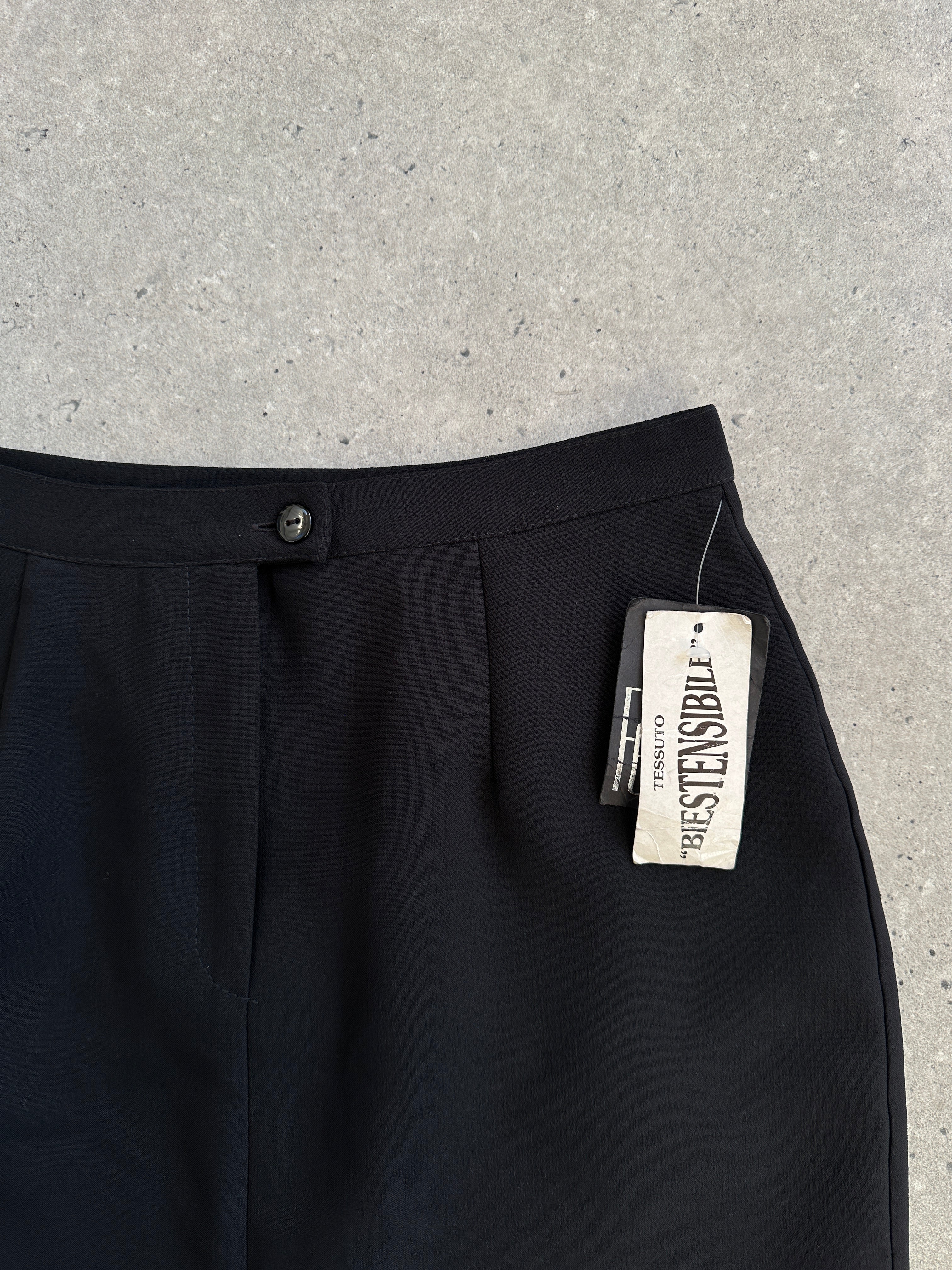 Vintage Italian 1990s maxi skirt in W26, featuring colorful retro fabric and flowing silhouette.