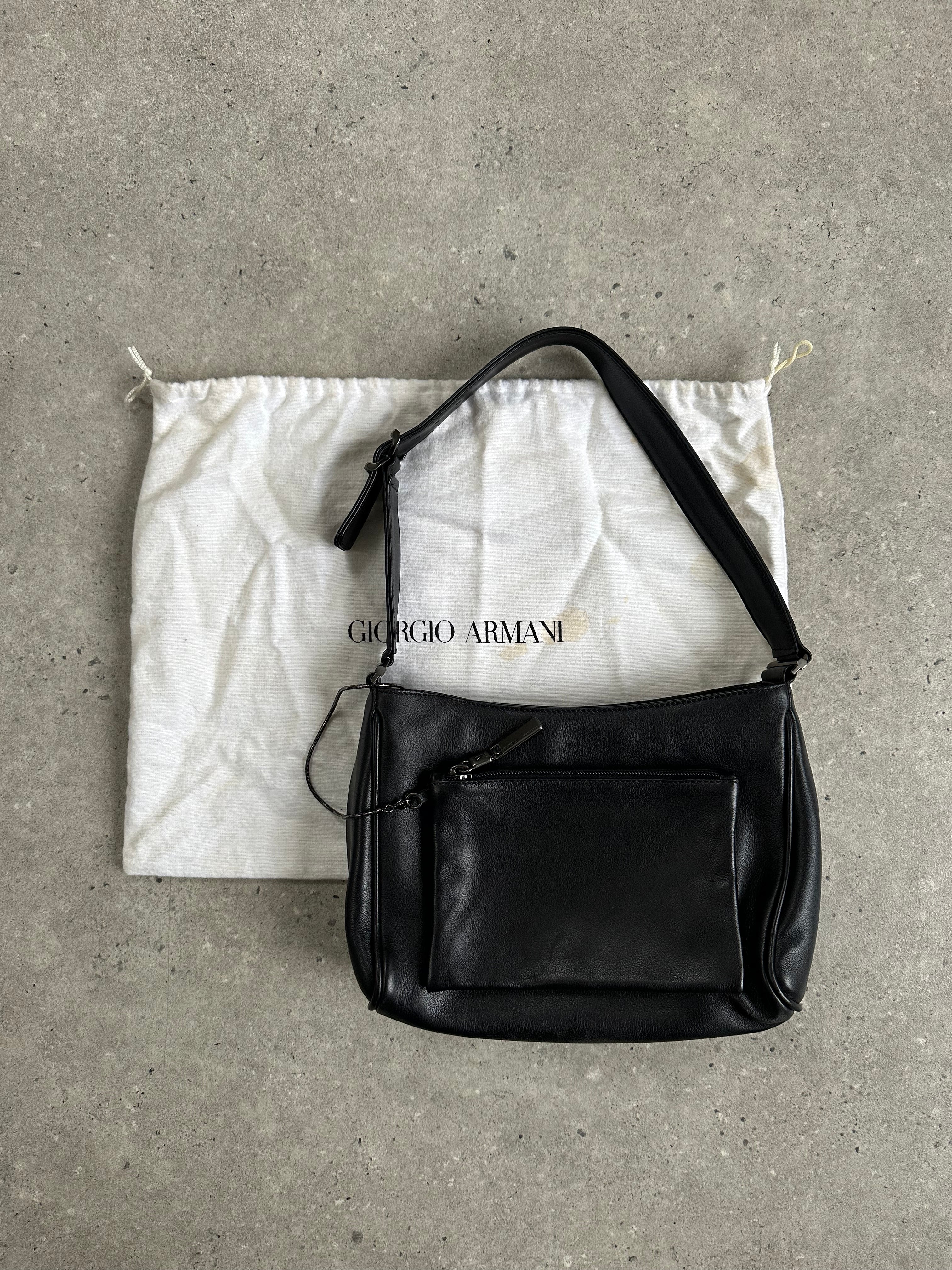 Giorgio Armani 2000s leather shoulder bag with sleek design, featuring a structured silhouette and subtle brand detailing.