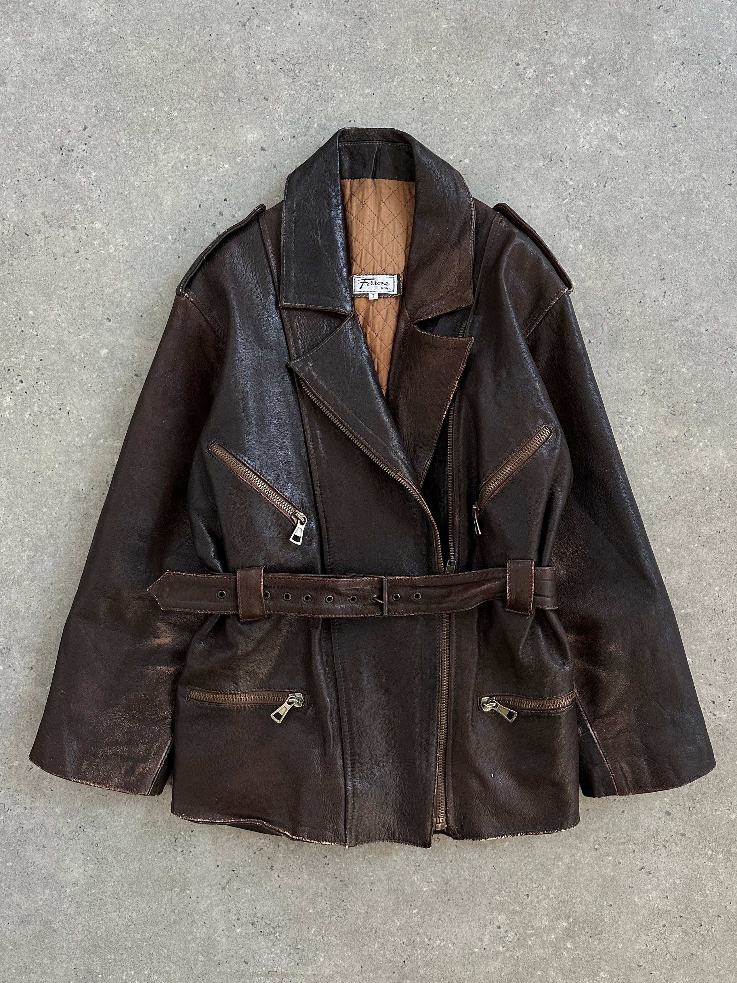 Vintage Italian 1990s belted leather jacket, aged brown leather, classic style, size M, with silver buckle details and vintage finish.