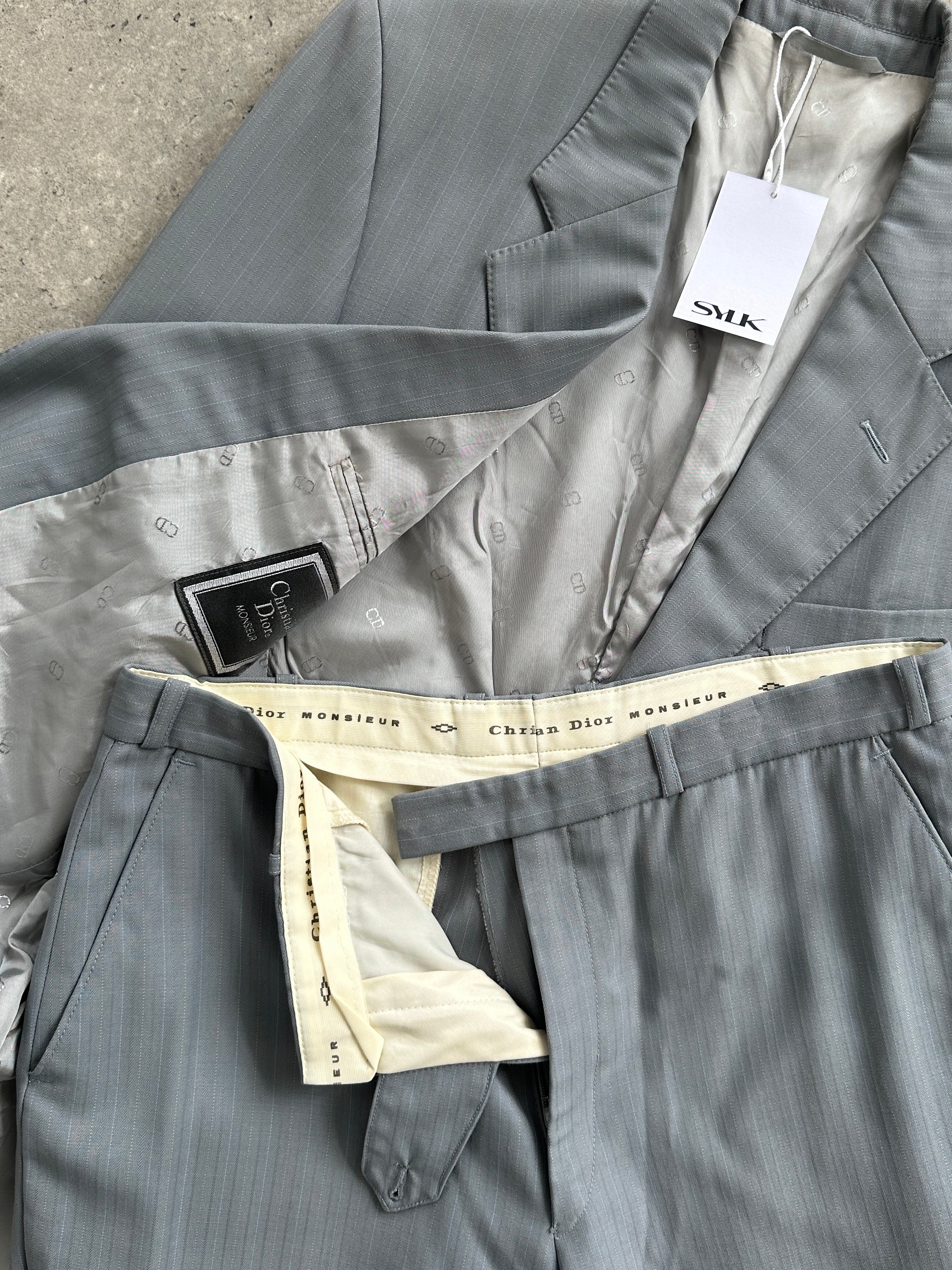 Christian Dior wool single-breasted suit jumpsuit in size 44R/W32, featuring tailored design and classic style.