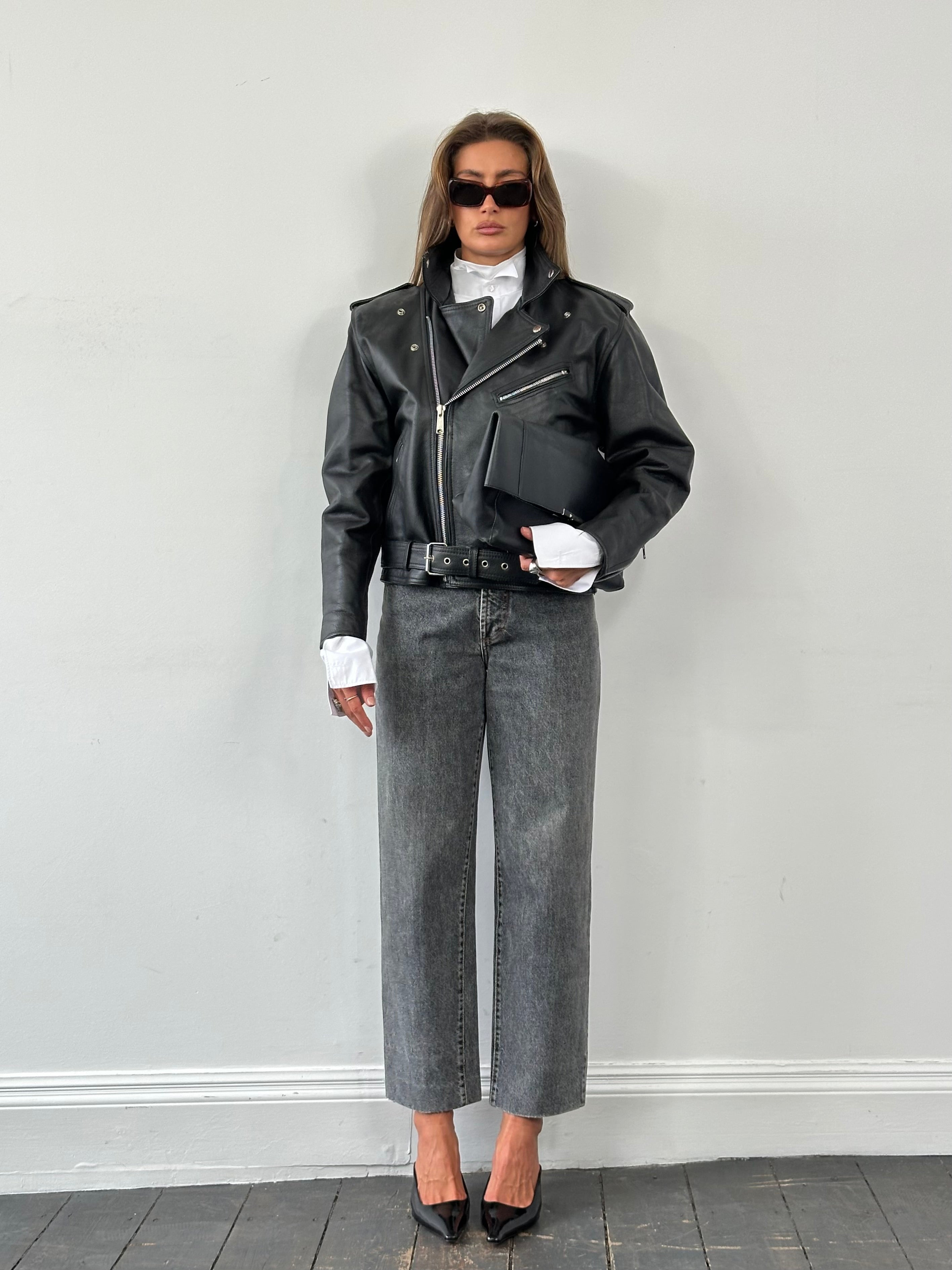 Vintage Italian 1990s high-waisted straight-leg denim jeans in W28 with classic blue wash and vintage detailing.