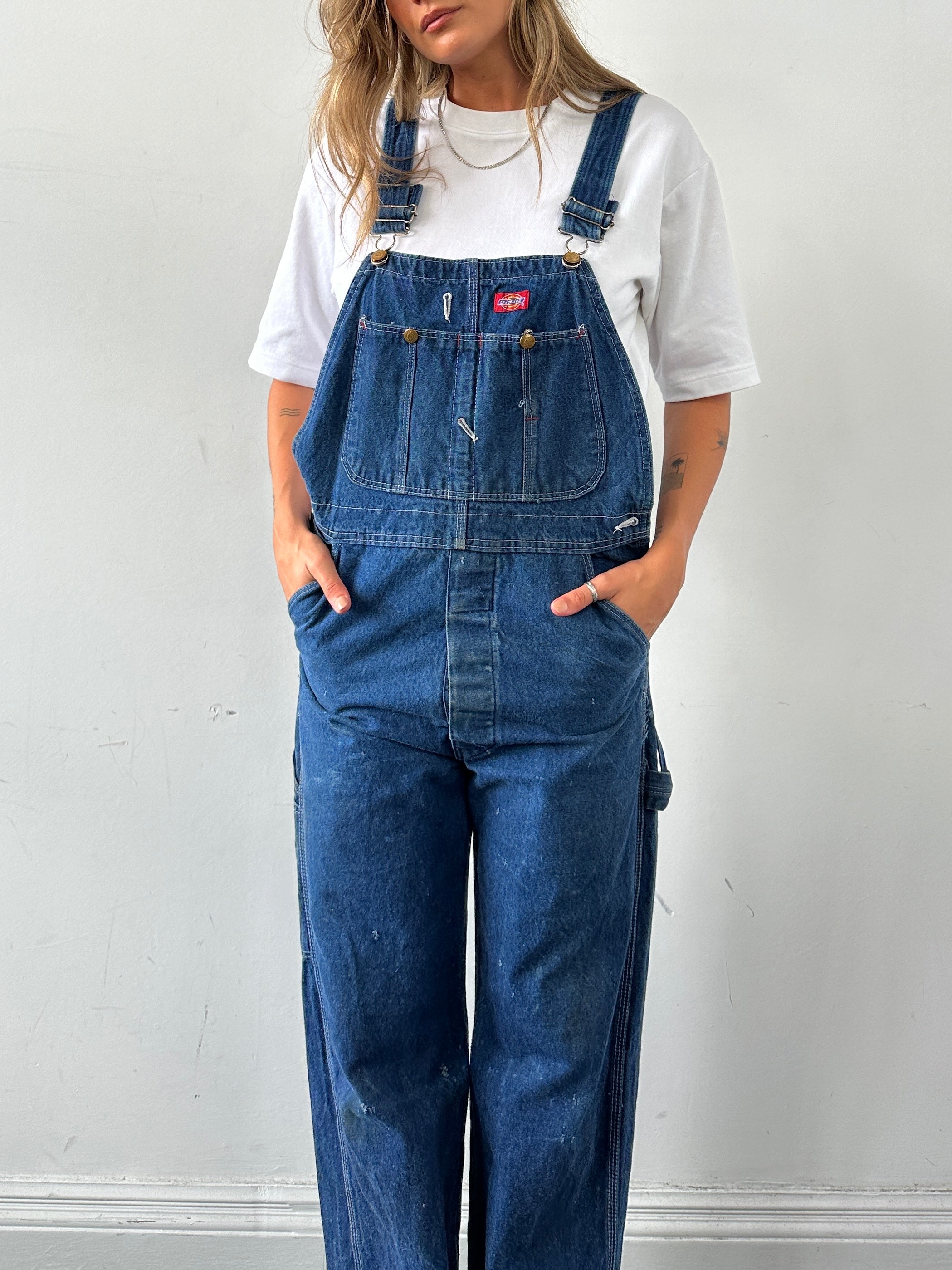 Dickies pure cotton denim dungarees in XS/S size, featuring classic bib design and adjustable straps on a neutral background.