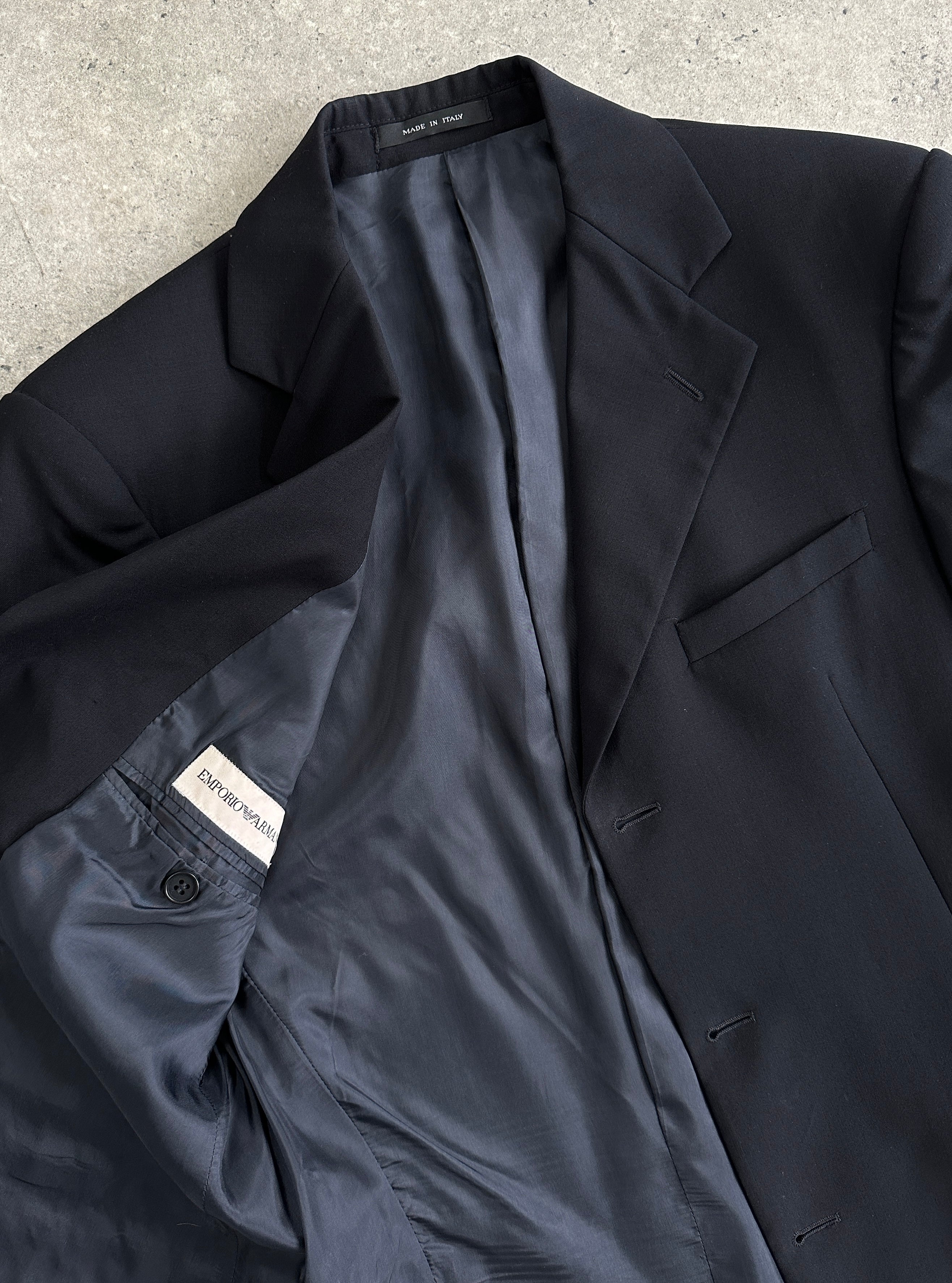 Emporio Armani wool single-breasted blazer in size 38R/M, tailored fit with classic lapel and button closure, in neutral color.