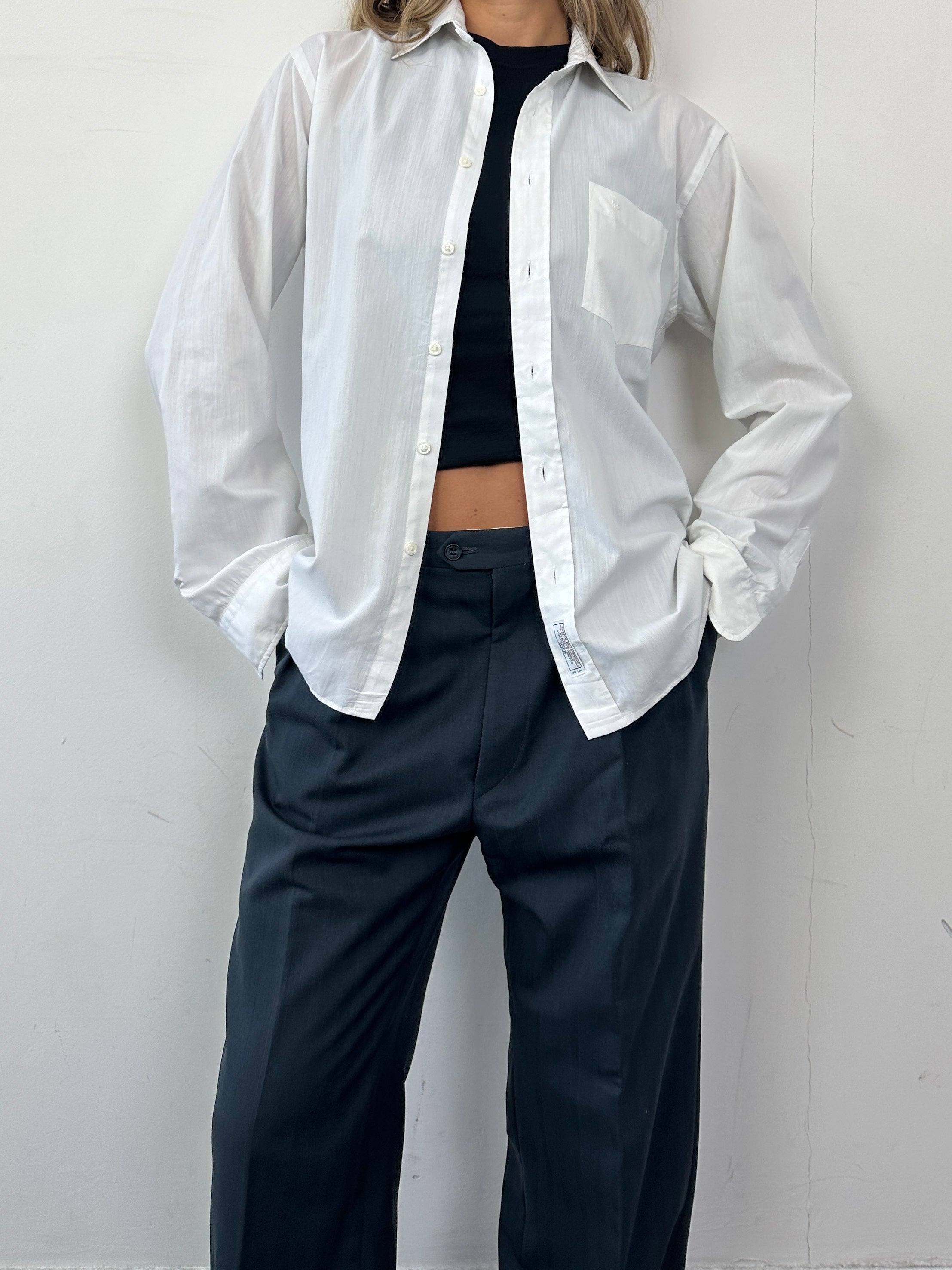 Christian Dior wool tapered leg tailored trousers in dark fabric, W32, featuring a sleek, precise fit and classic design.