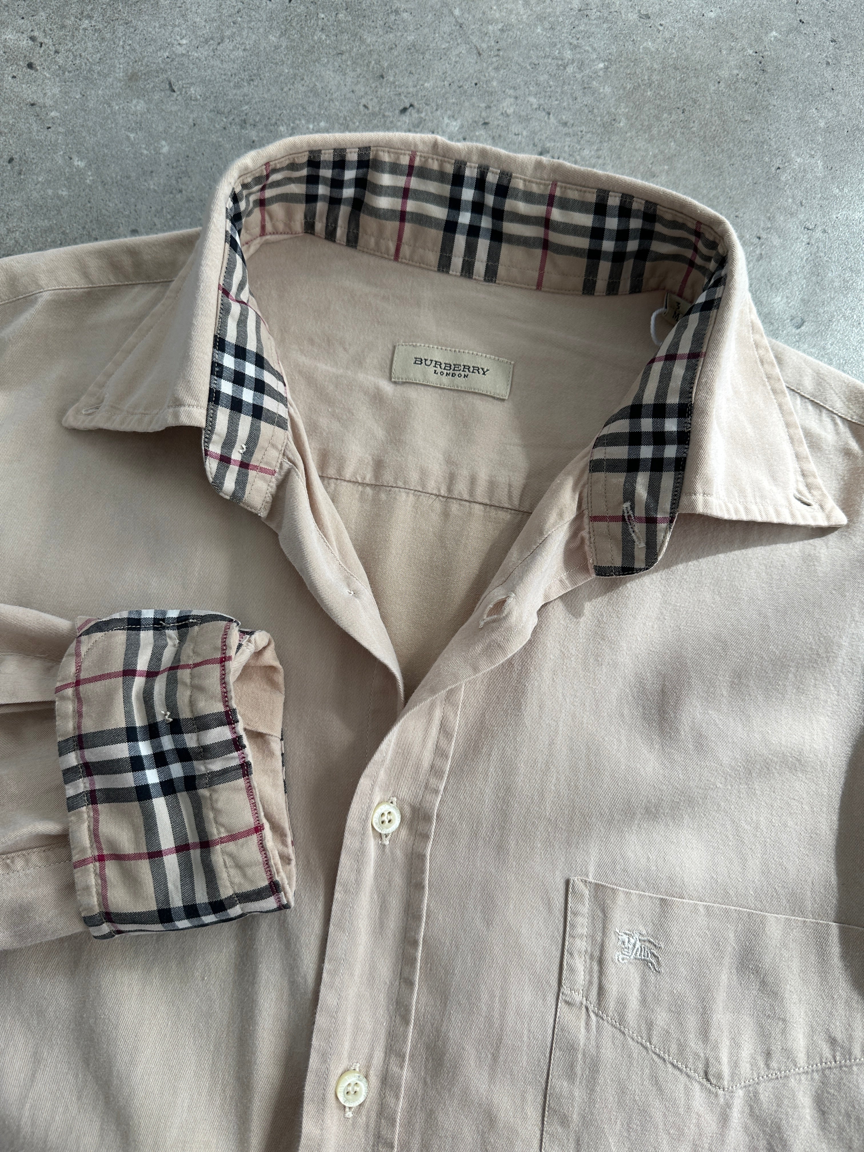 Burberry London pure cotton logo shirt in size M/L, featuring the iconic Burberry branding and classic shirt design.