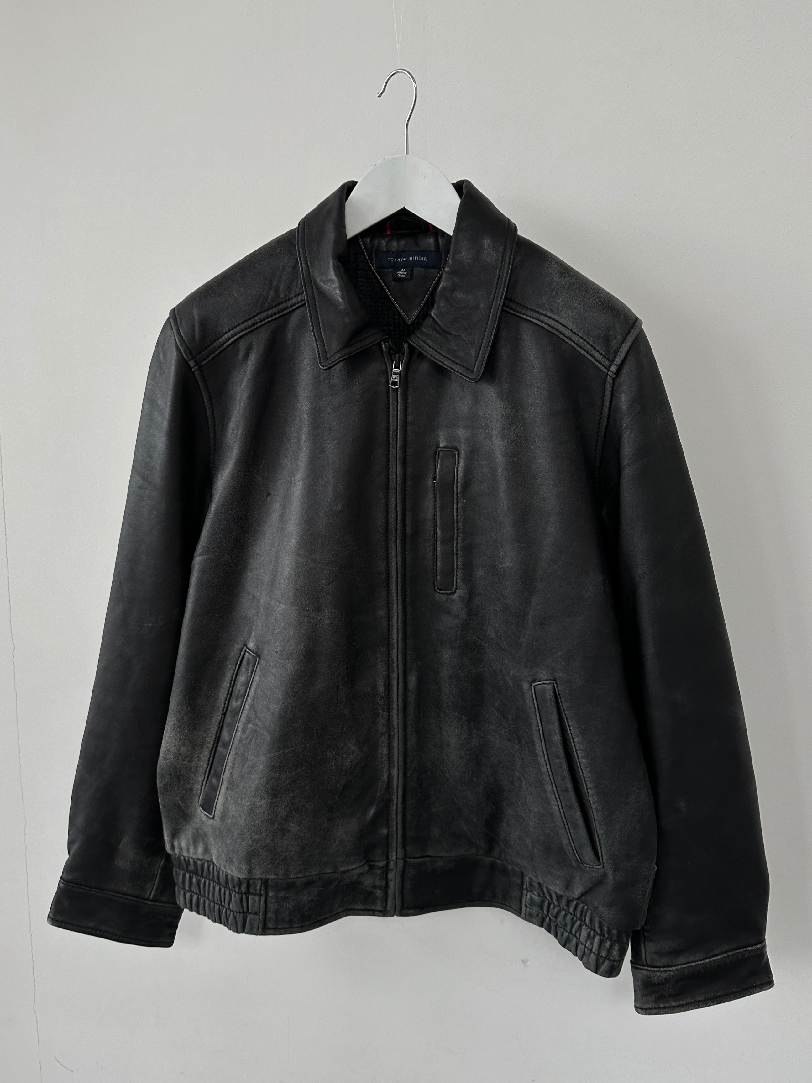 Tommy Hilfiger distressed leather bomber jacket in size M, featuring a classic design with a worn-in leather finish.