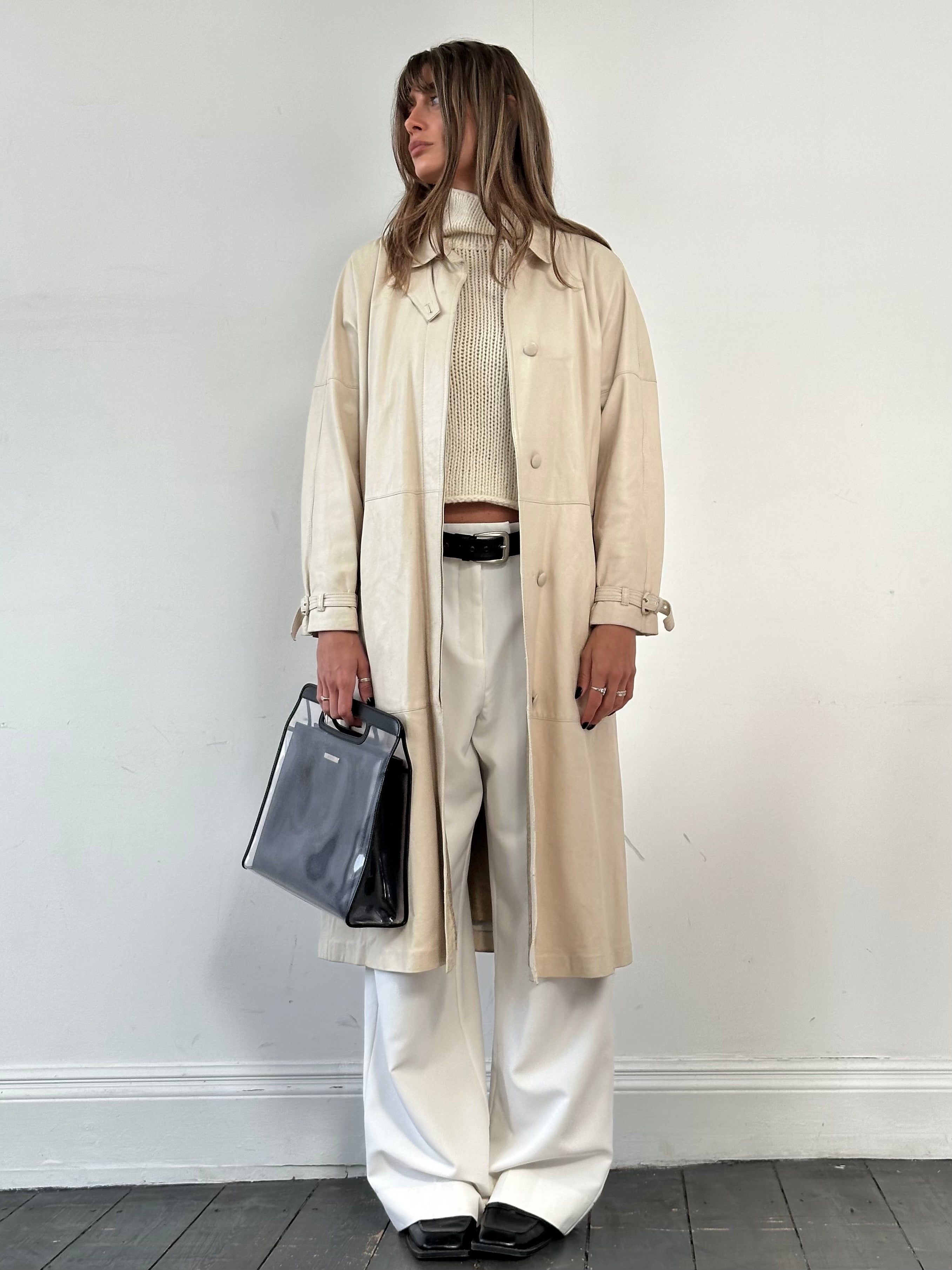 Vintage leather trench coat with belt, long leather jacket, stylish vintage outerwear, in M/L size, featuring classic design and detailing.