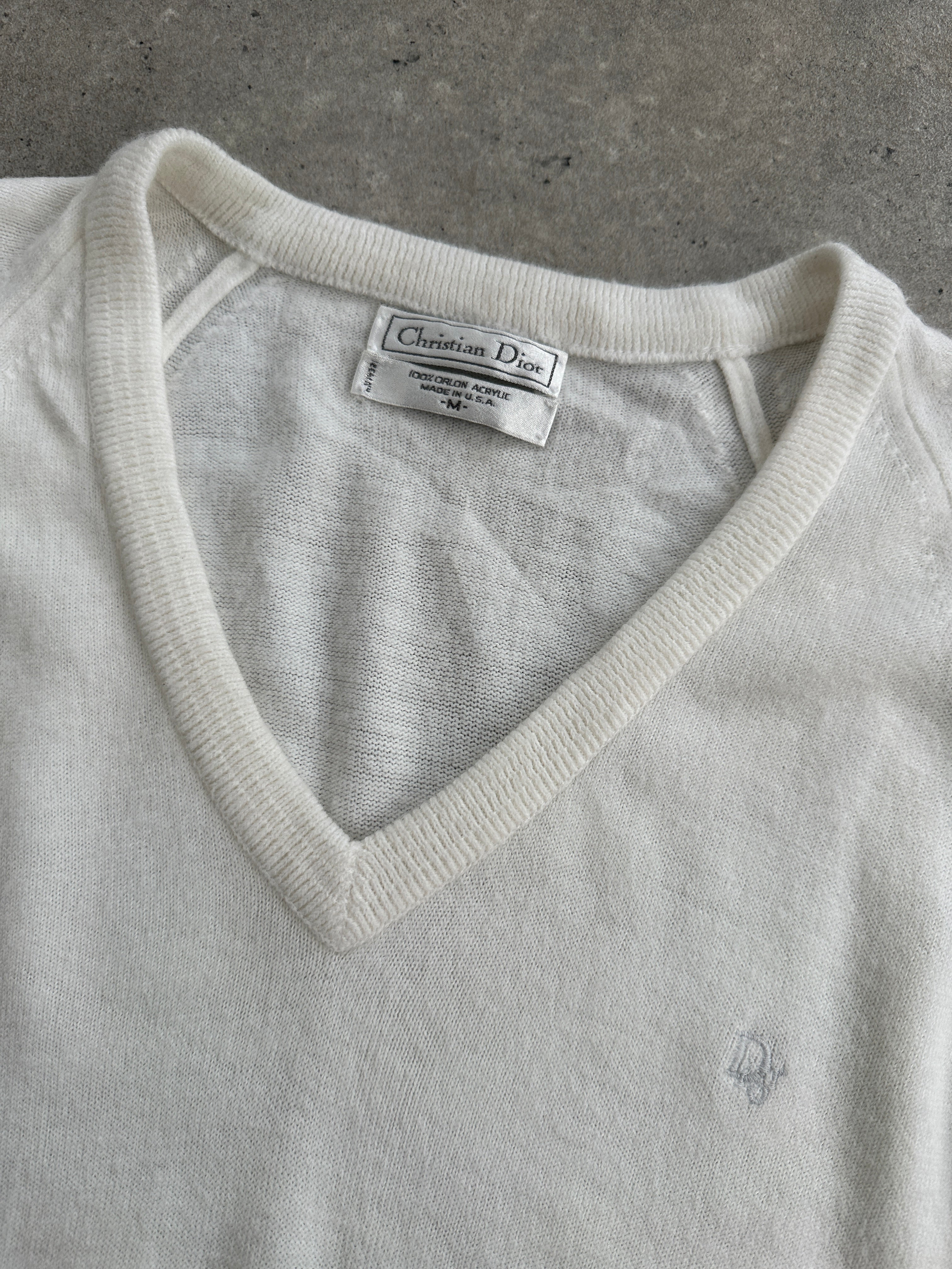 Christian Dior V neck logo knitted jumper in size L, featuring a classic design with the Dior logo on the front.