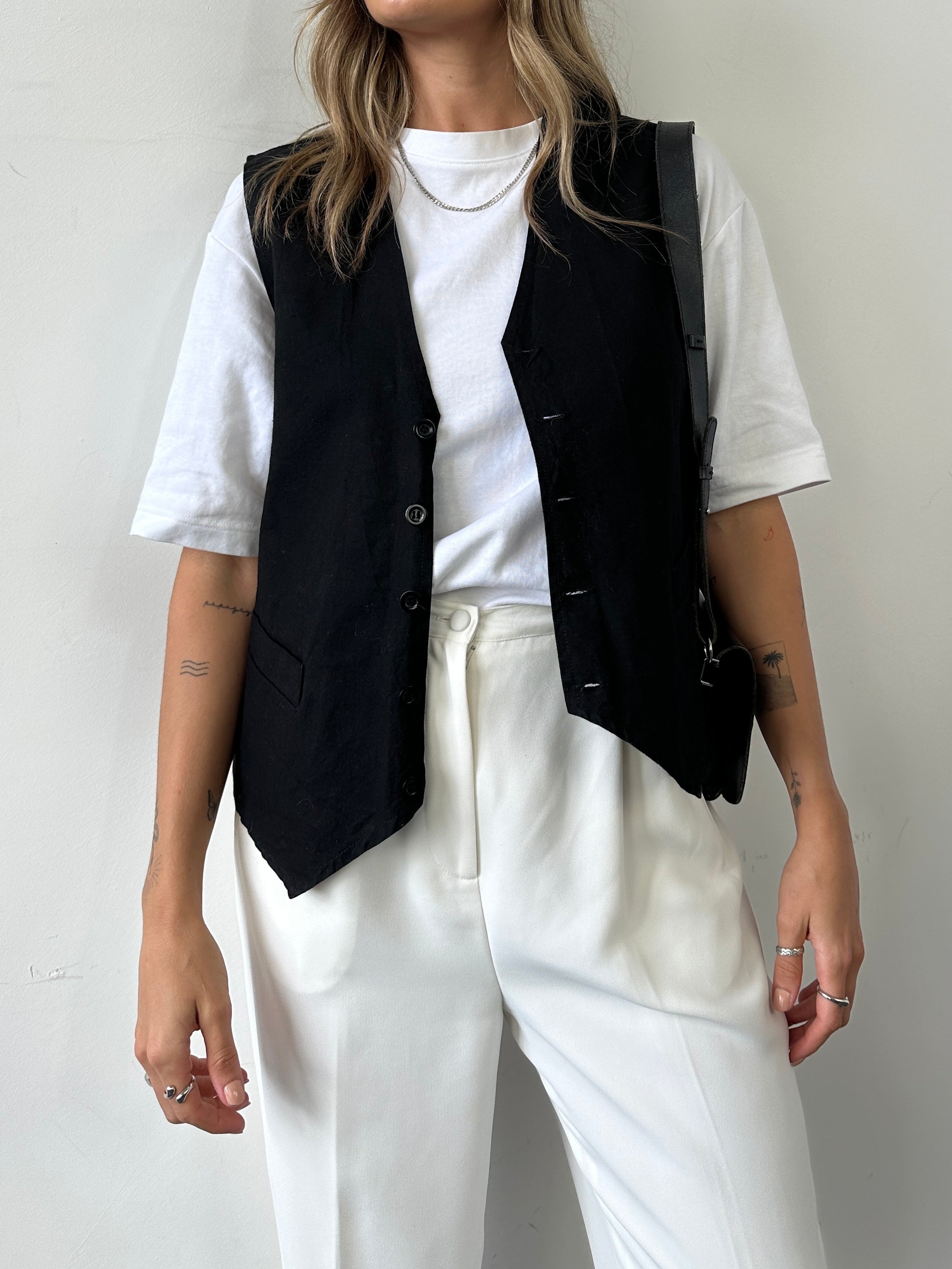 Vintage brand vintage cotton waistcoat coat in XL size, featuring classic design and button details, shown on a hanger.