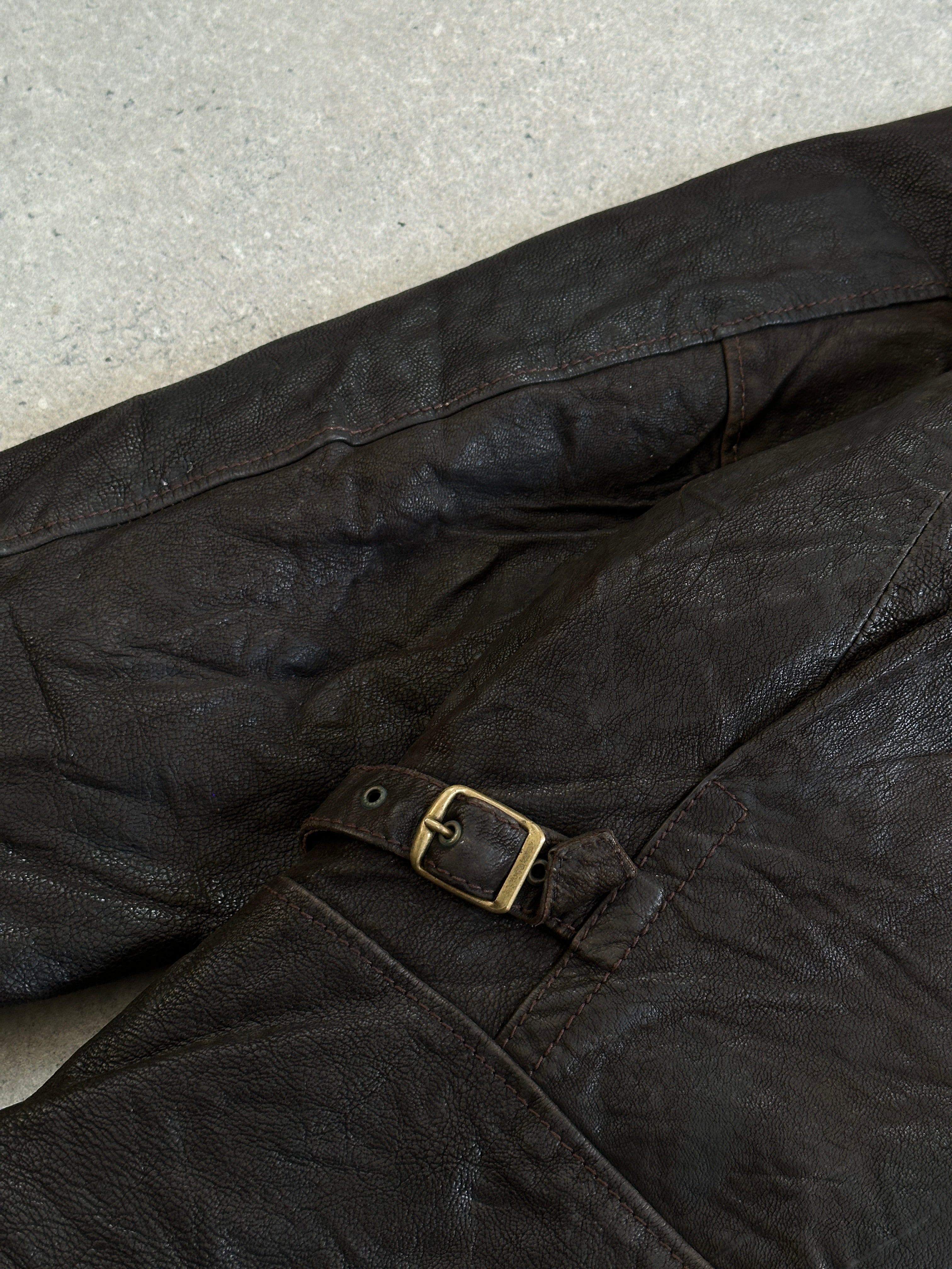 Vintage 1980s leather jacket with concealed placket, size large/x-large, featuring classic vintage style and detailed craftsmanship.