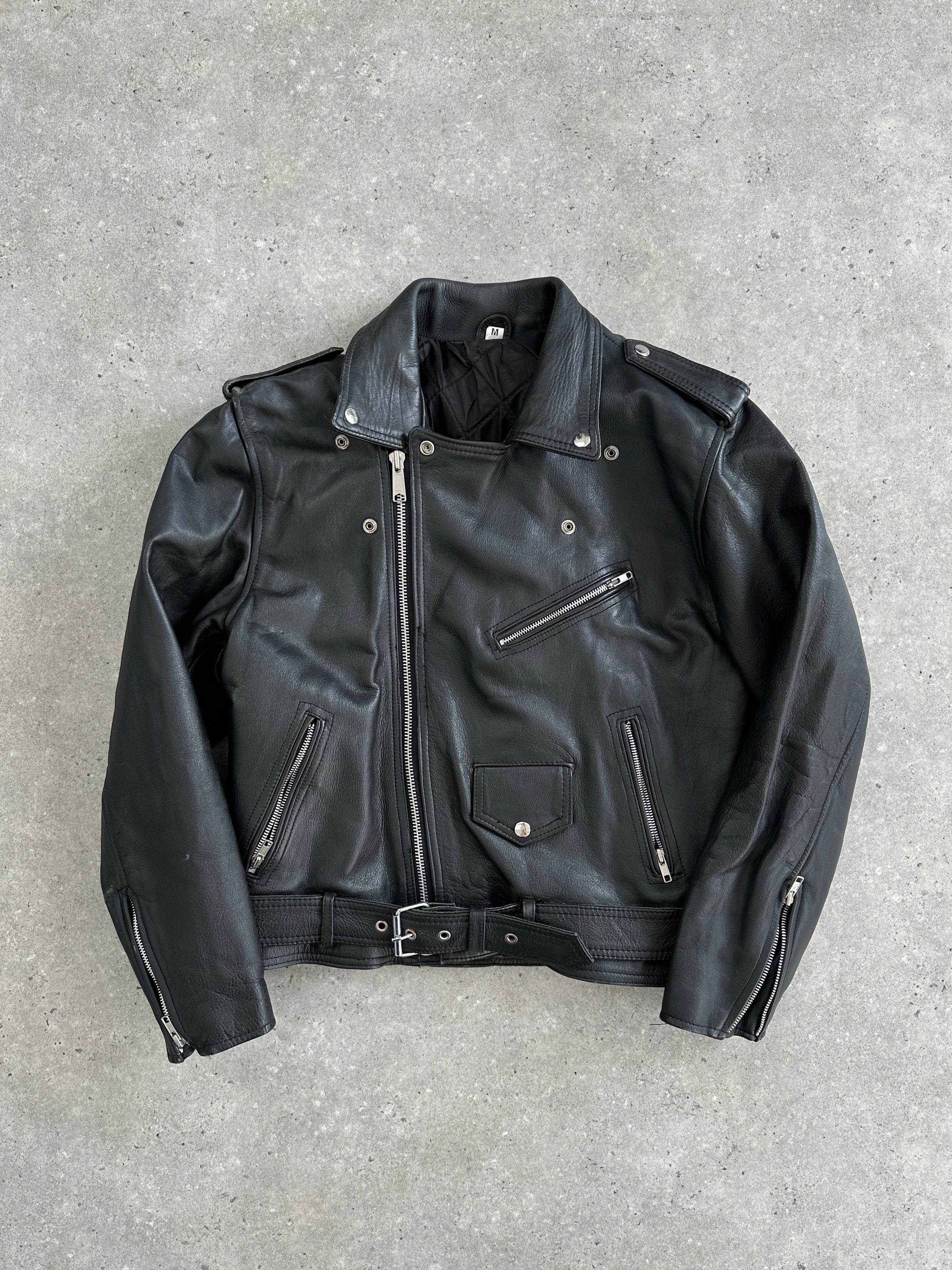 Vintage 1990s leather biker jacket in size M with classic design, featuring metal hardware and distressed leather finish.