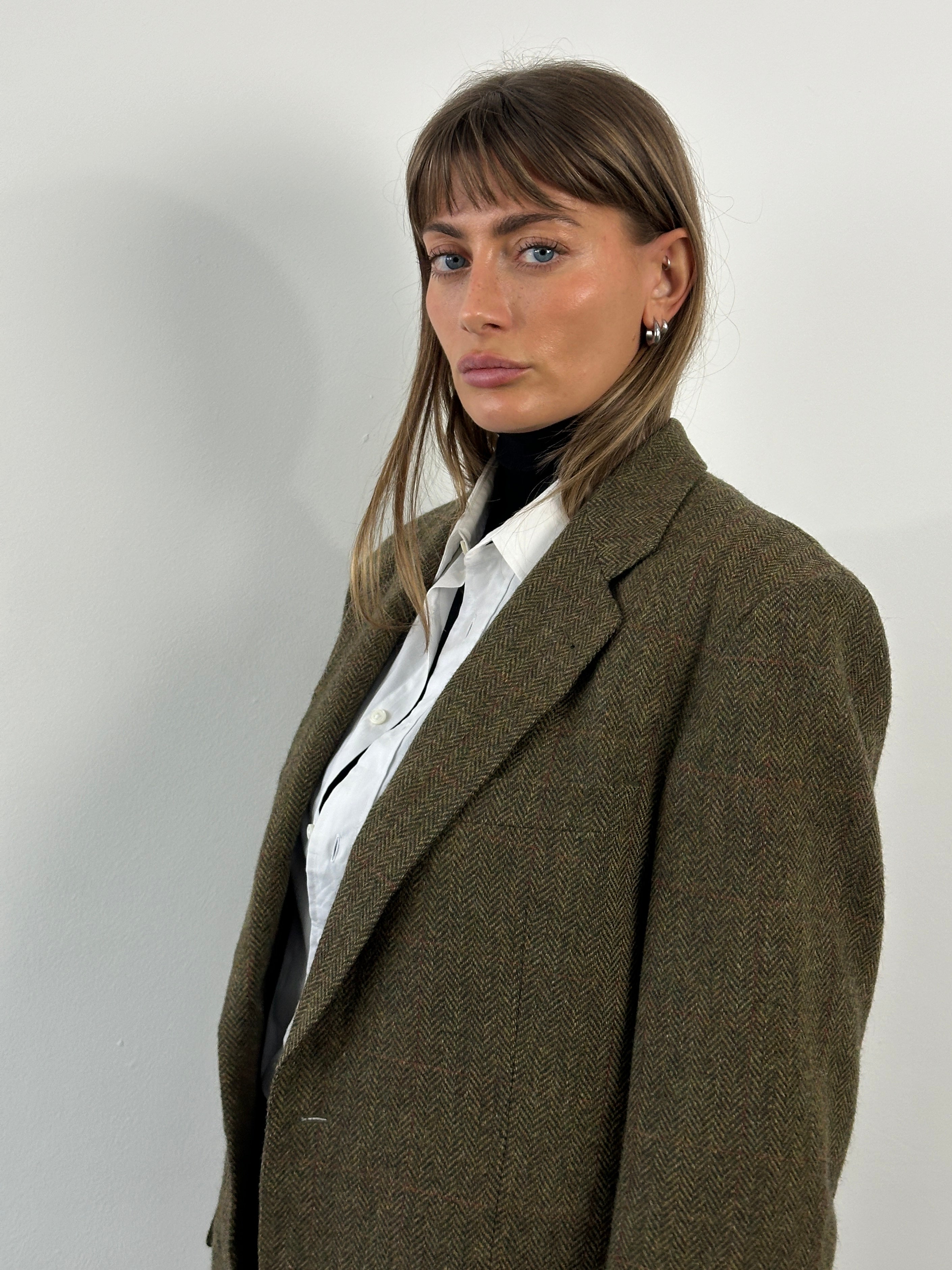 Burberry 1990s pure wool brushed single-breasted blazer in size 40R displayed on a hanger with a classic tailored fit.