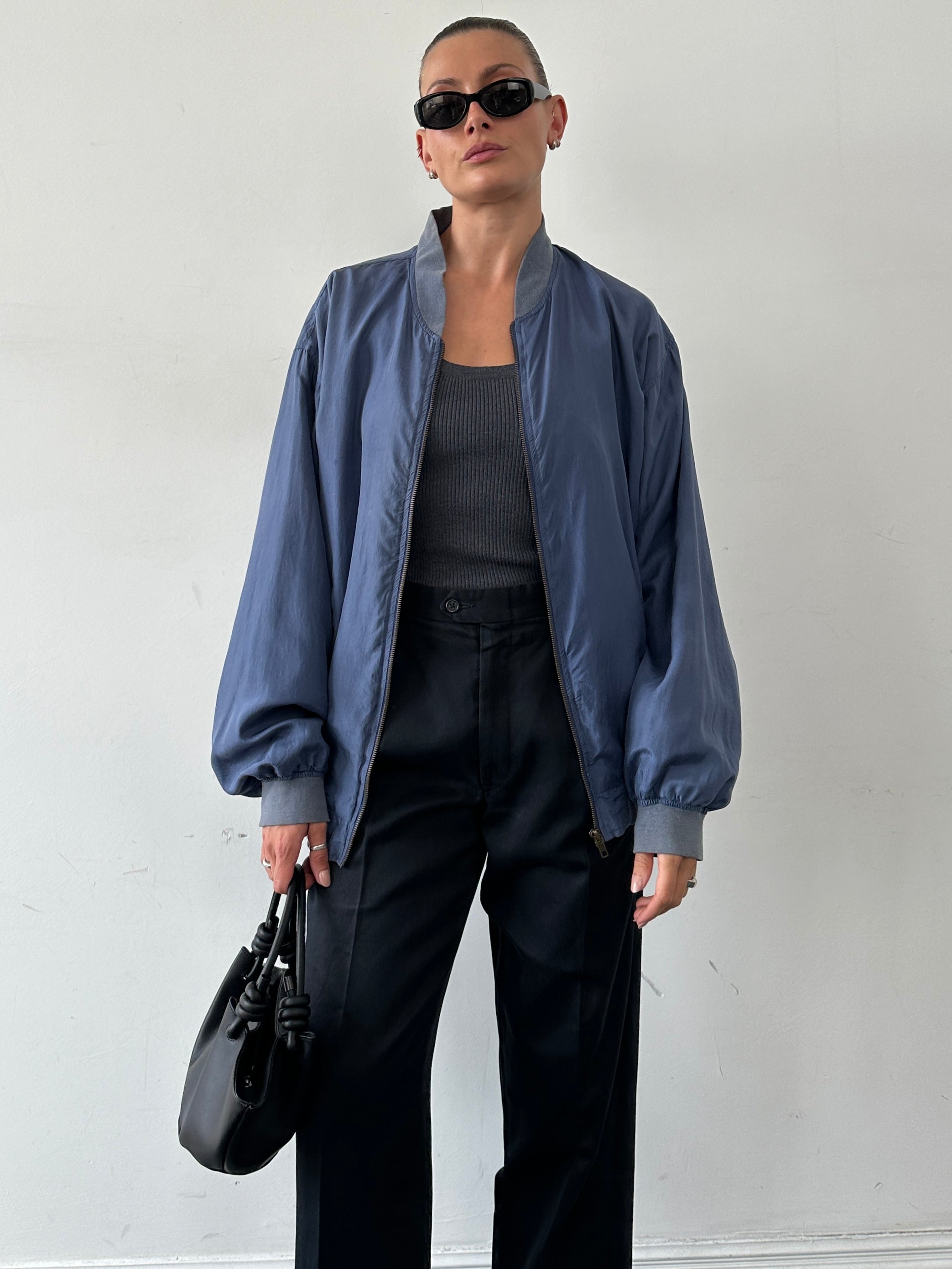 Vintage pure silk bomber jacket in size XL with a sleek, classic design and smooth silk fabric.