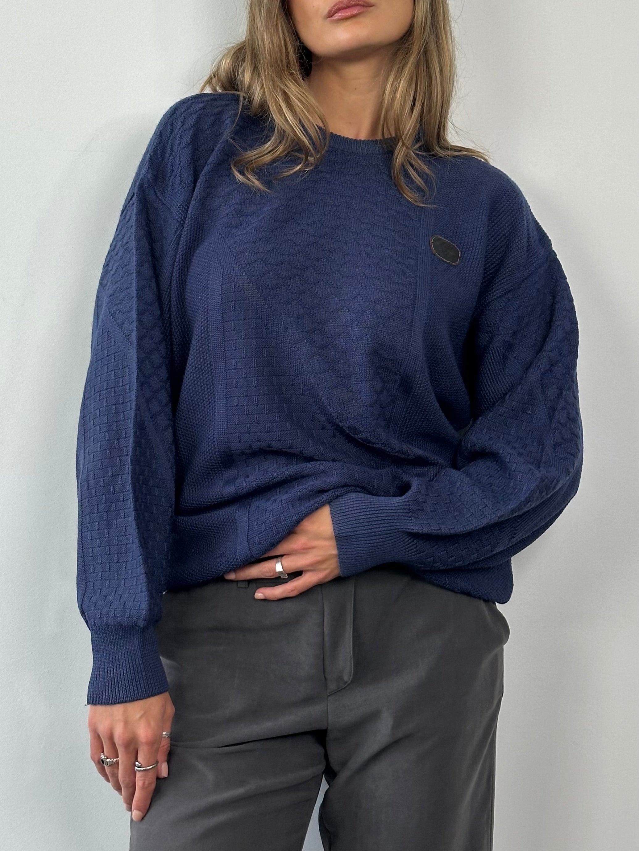 Valentino 1990s cotton cable knit logo jumper in size M/L, featuring a classic knit pattern and the brand's signature logo detail.
