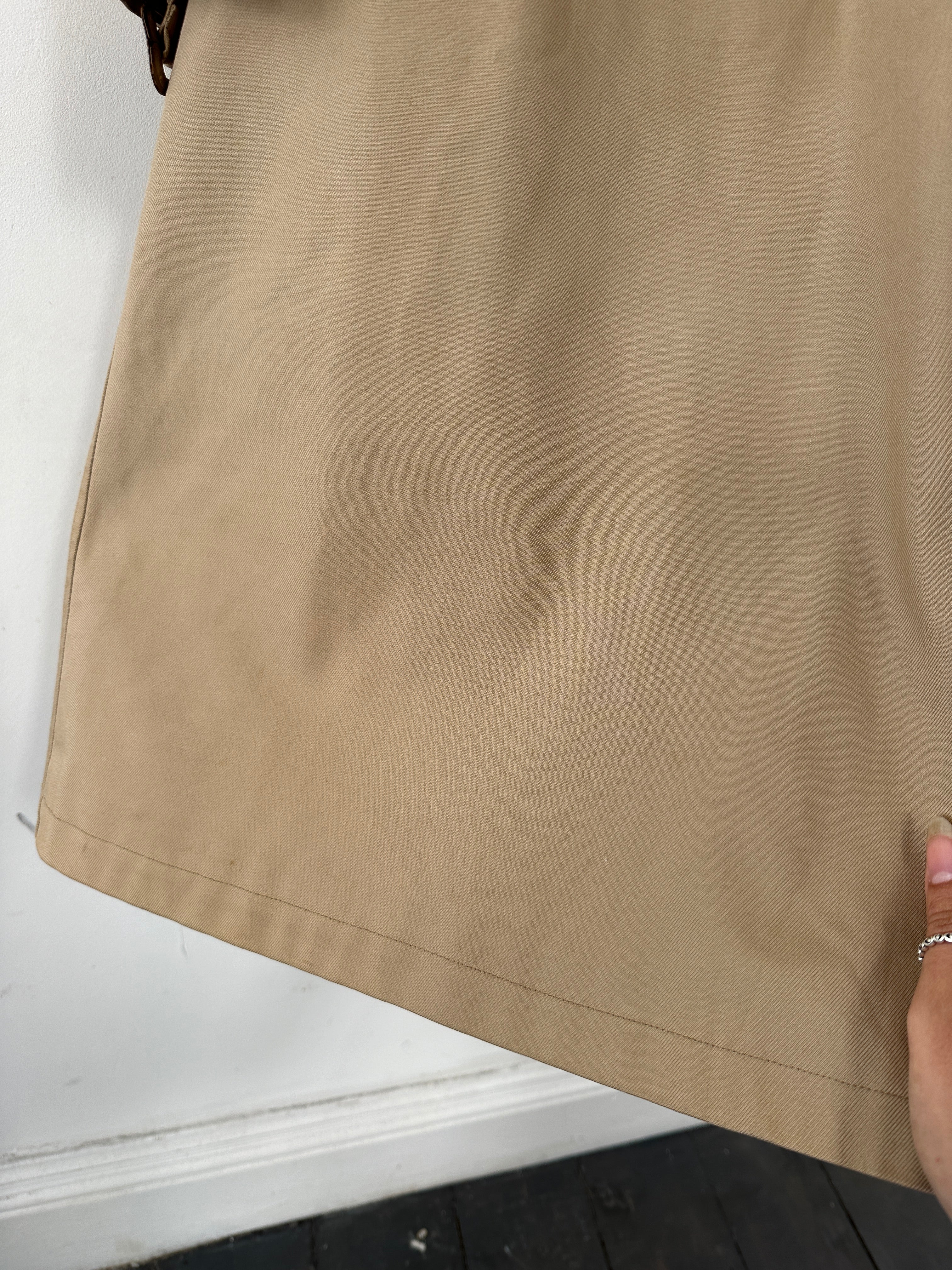 Vintage cotton belted trench coat in XL displayed on hanger, showcasing classic design and timeless style.