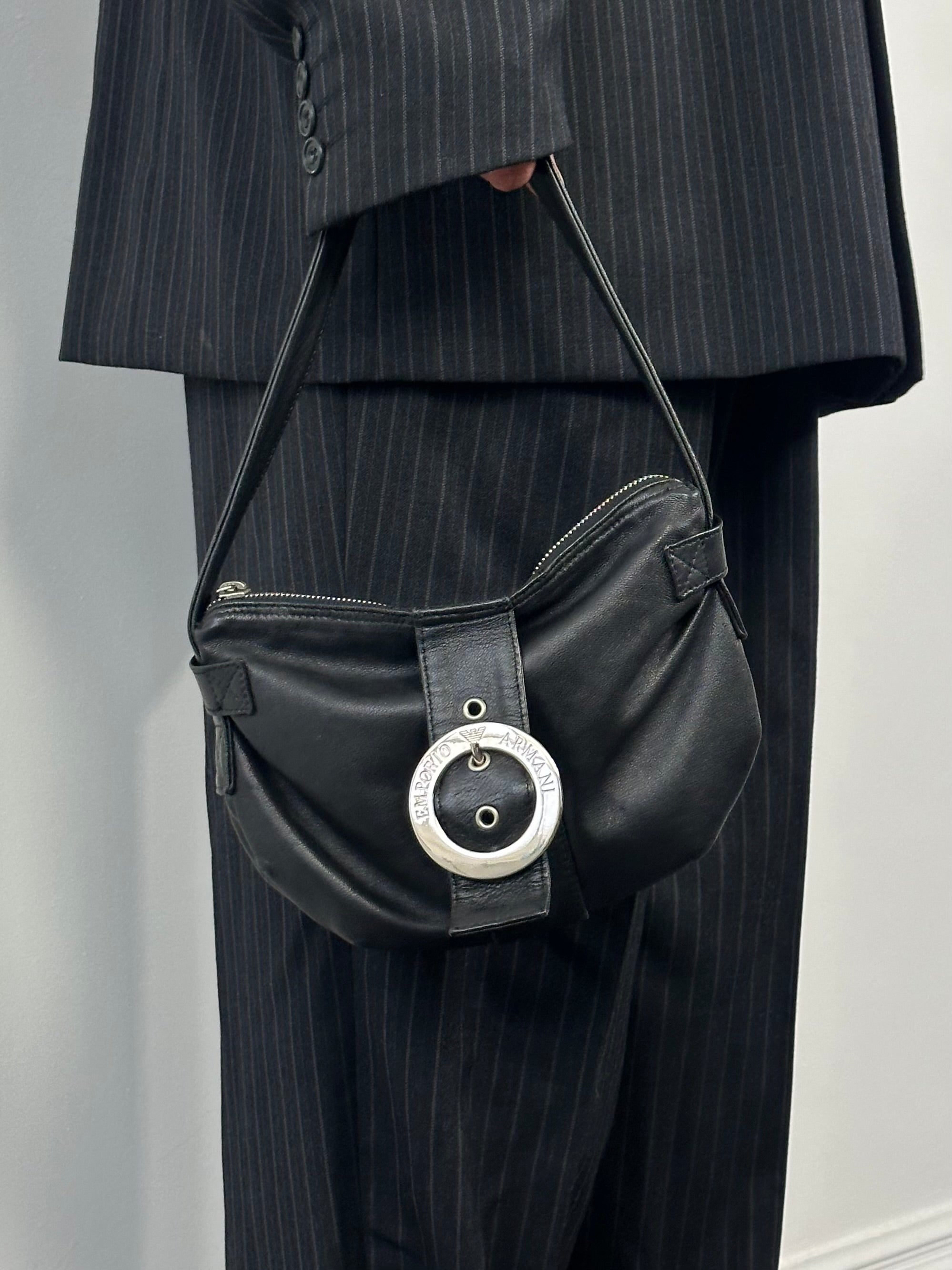 Emporio Armani leather shoulder bag with sleek design, featuring a smooth finish and adjustable strap for stylish everyday use.