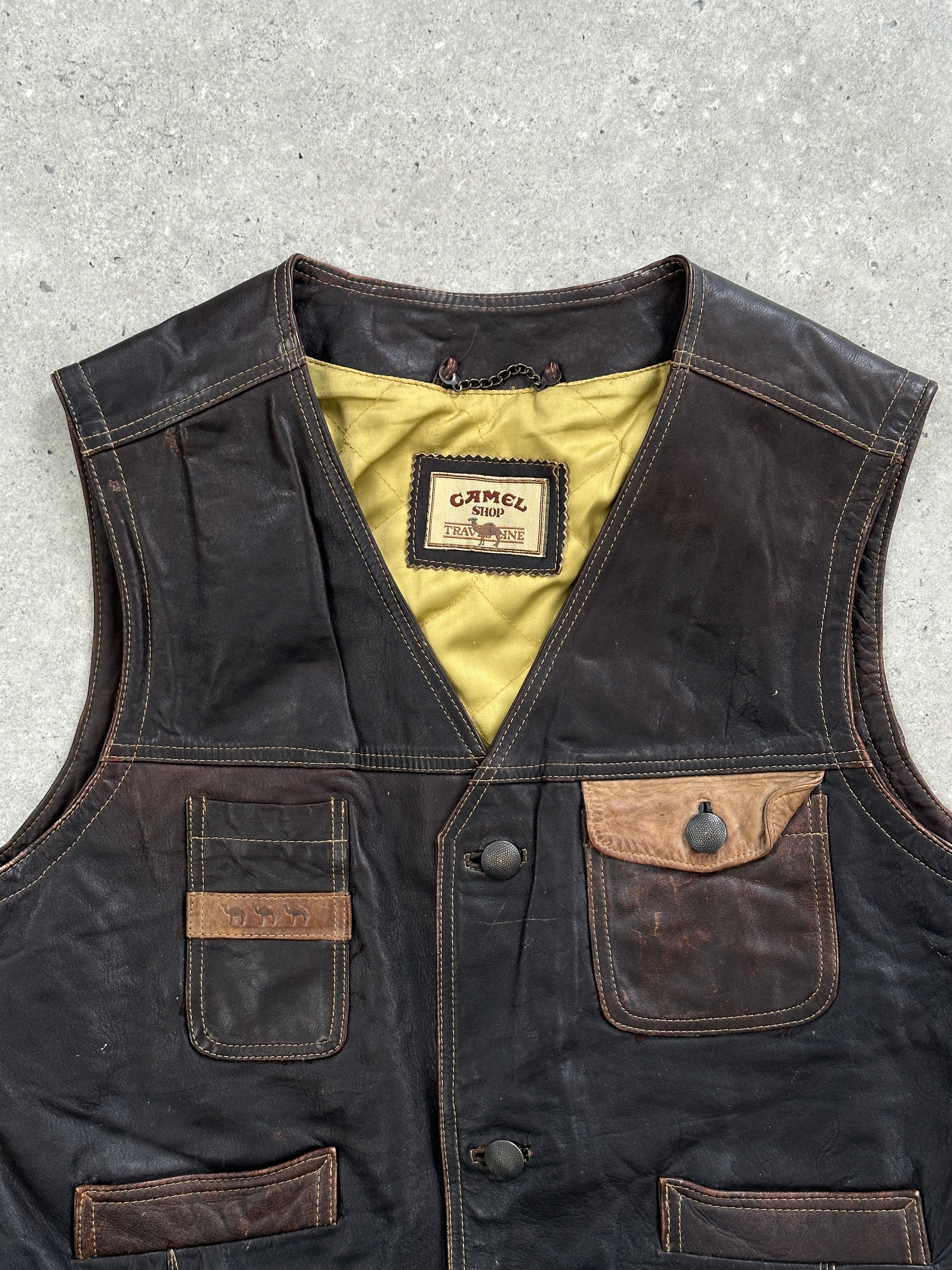Vintage camel distressed leather waistcoat in size M, featuring a rugged, worn-in look with textured leather and classic design details.