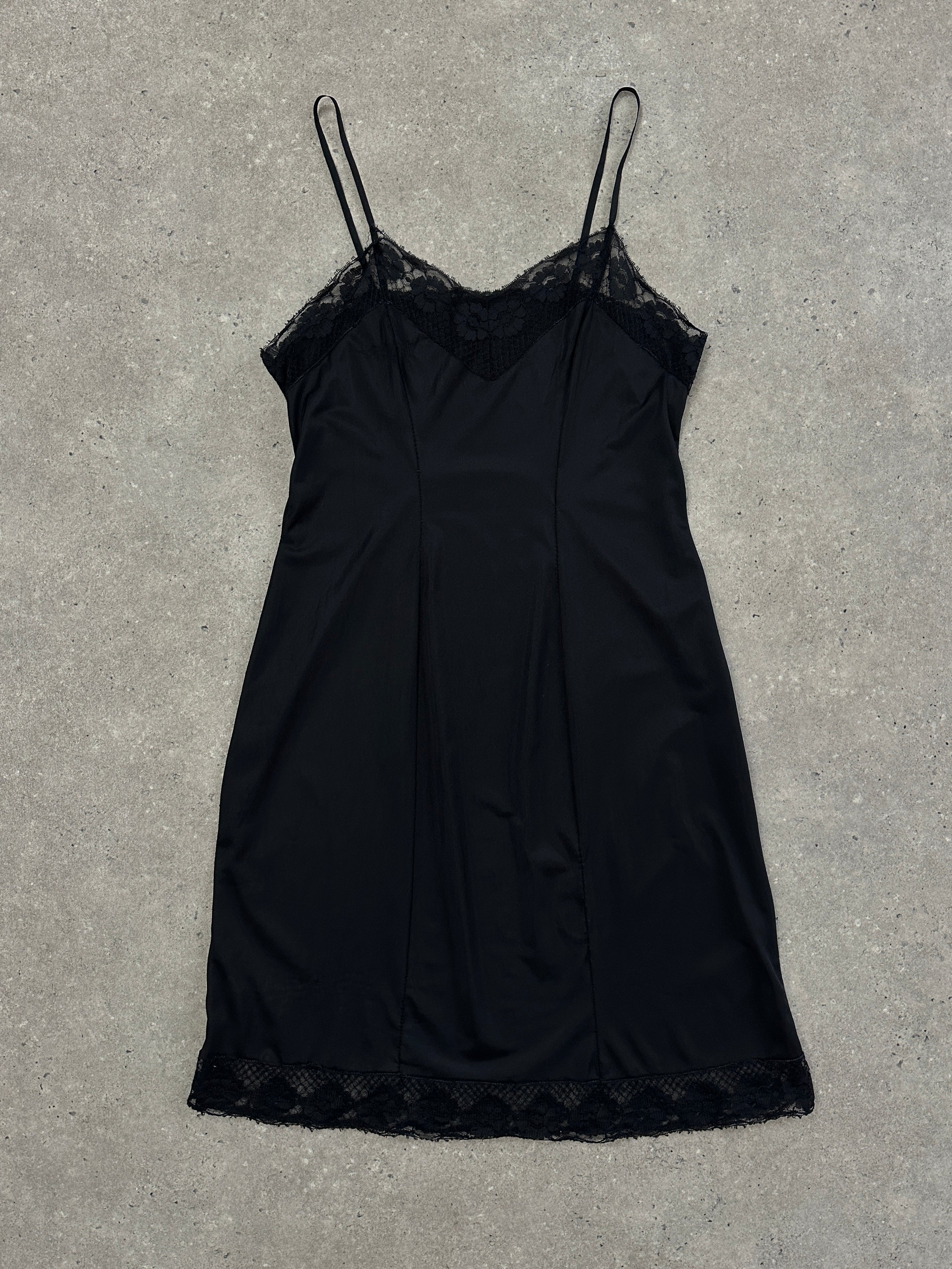 Vintage 1980s lace semi-sheer slip dress in size M, featuring delicate lace details and a classic vintage silhouette.