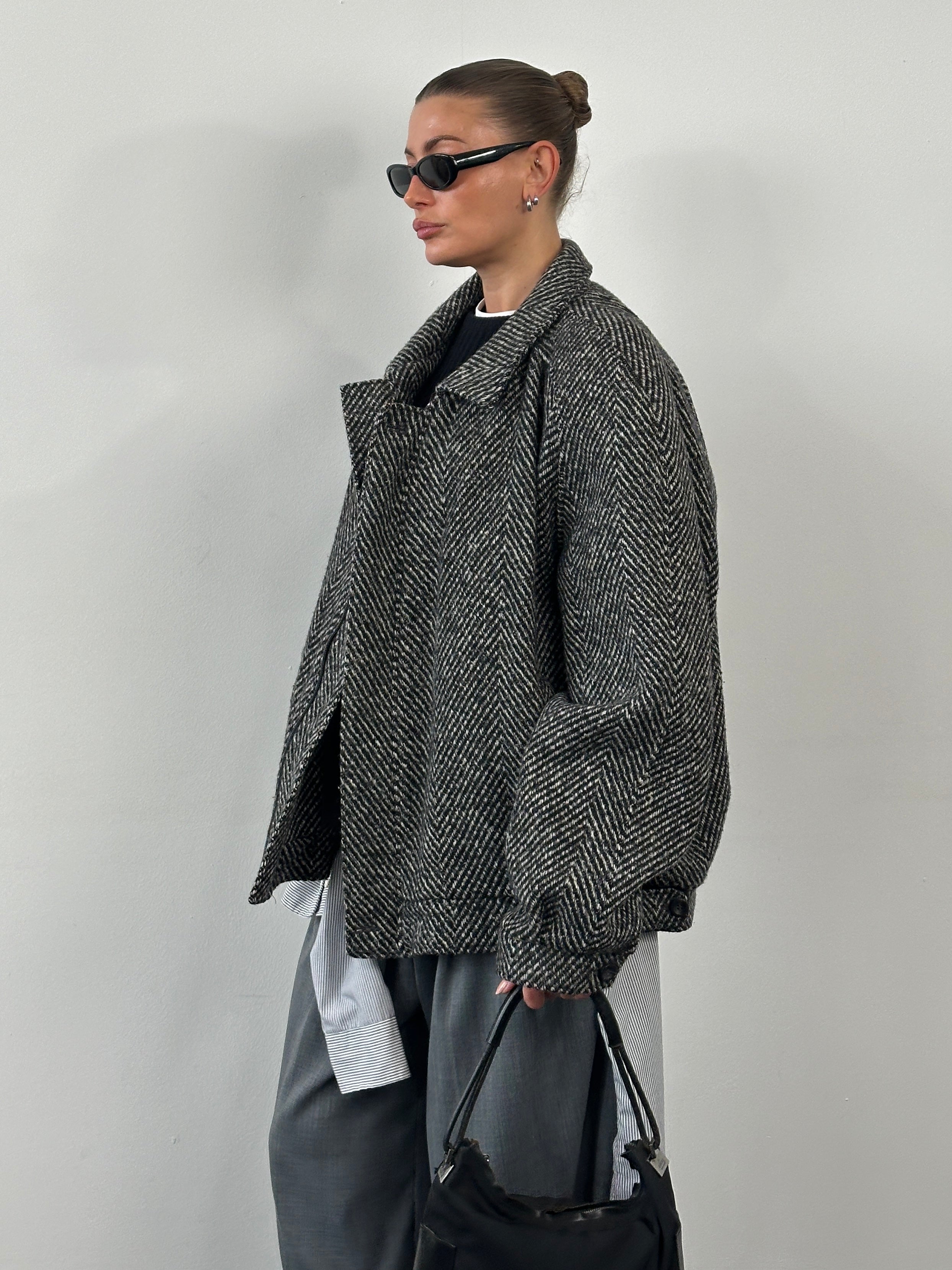 Vintage 1990s wool herringbone bomber jacket in XXL, featuring a classic collar, front zipper, and ribbed cuffs.
