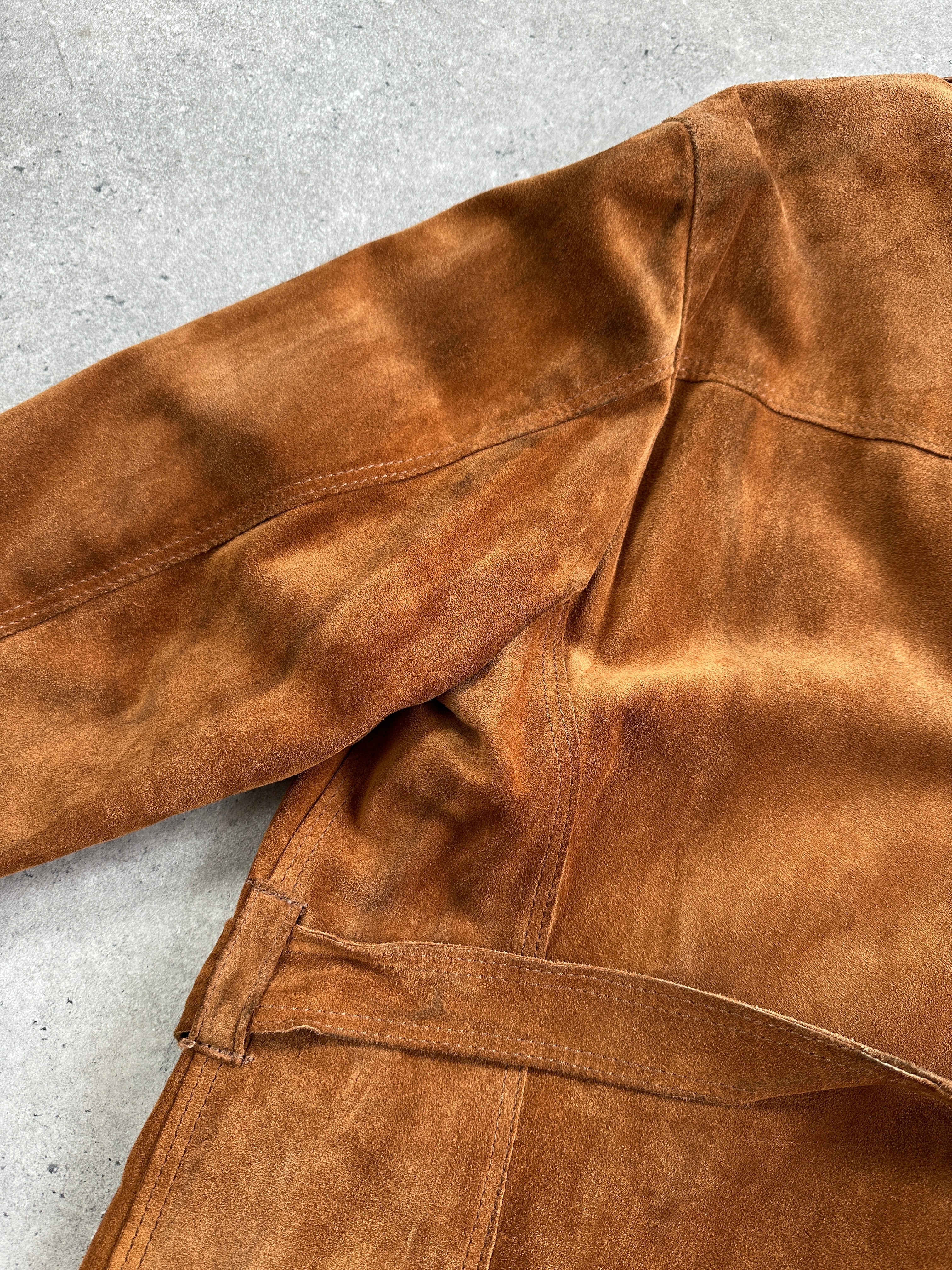 Vintage Italian suede belted jacket in M/L size with classic design and textured suede material, displayed on a hanger.