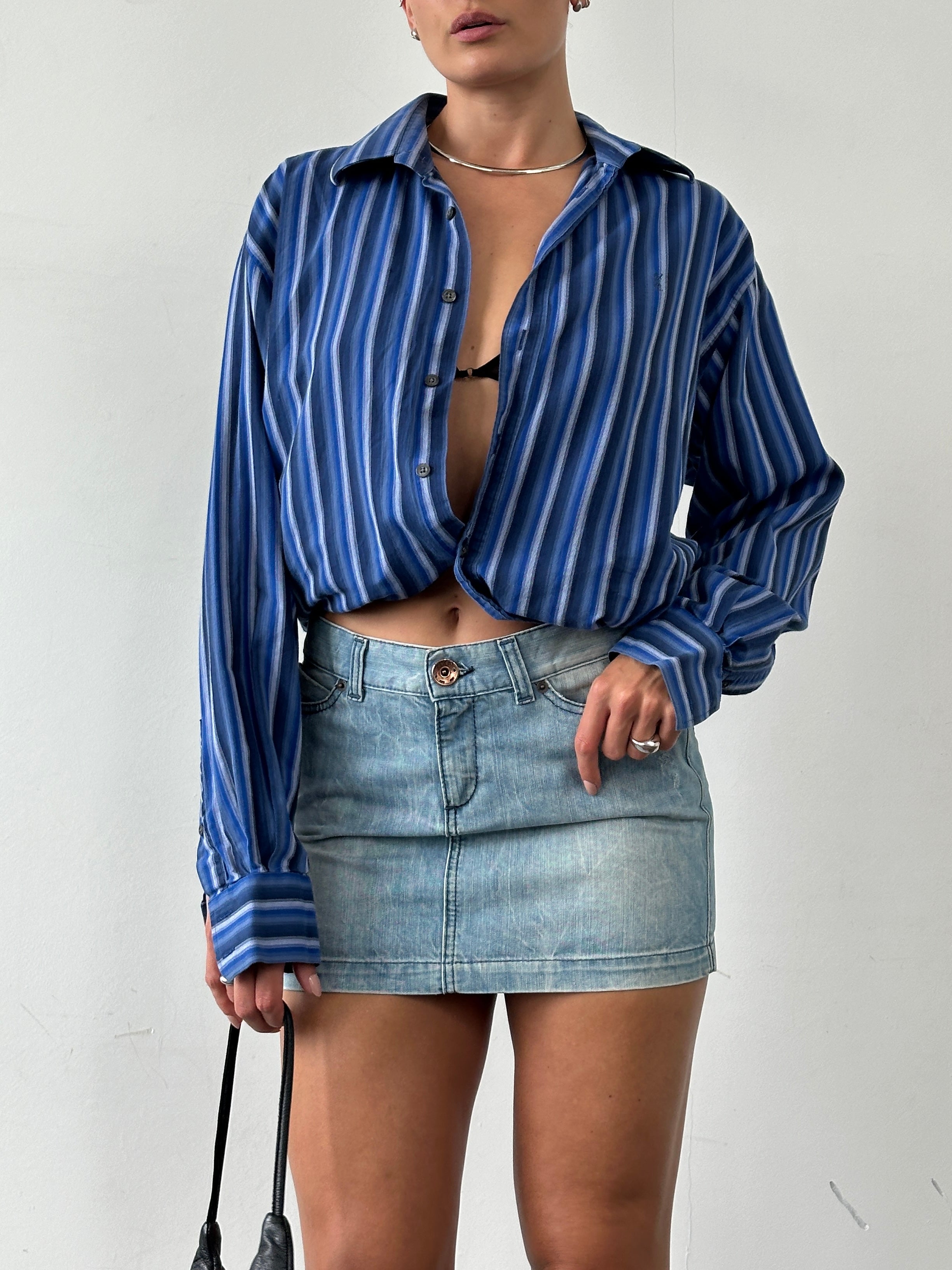 Miss Sixty 2000s denim mini skirt in size W30, featuring classic blue wash and stylish short length, casual fashion piece.